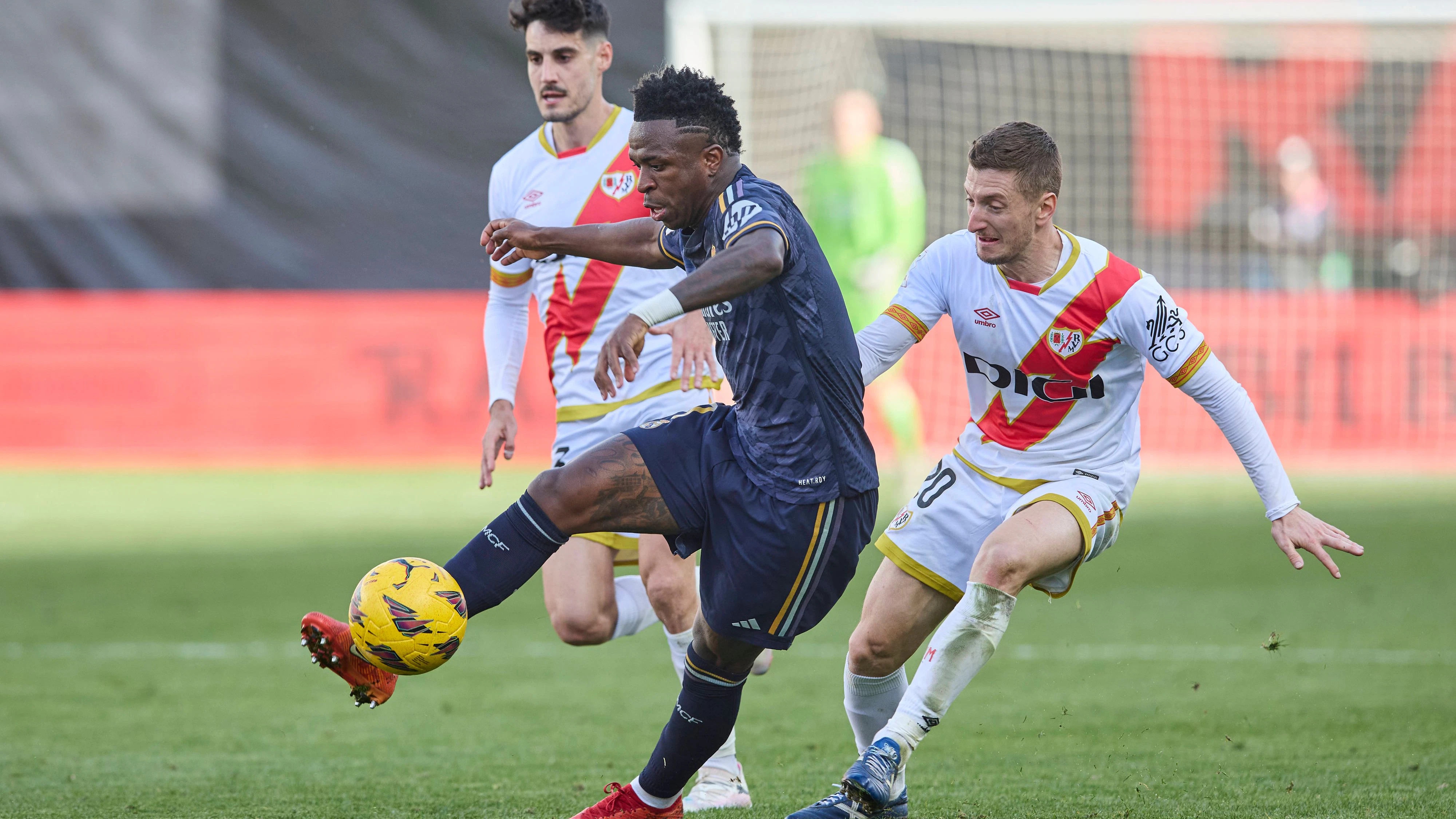 Vinicius Jr Real Madrid CF and Ivan Balliu Rayo Vallecano battle for the ball, La Liga EA Sports match round 25, Rayo Vallecano v Real Madrid, Vallecas Stadium, February 18, 2024, Madrid, Spain.