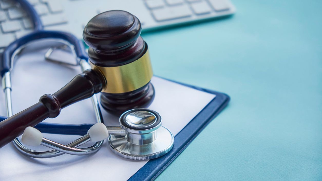 Gavel and stethoscope. medical jurisprudence. legal definition of medical malpractice. attorney. common errors doctors, nurses and hospitals make