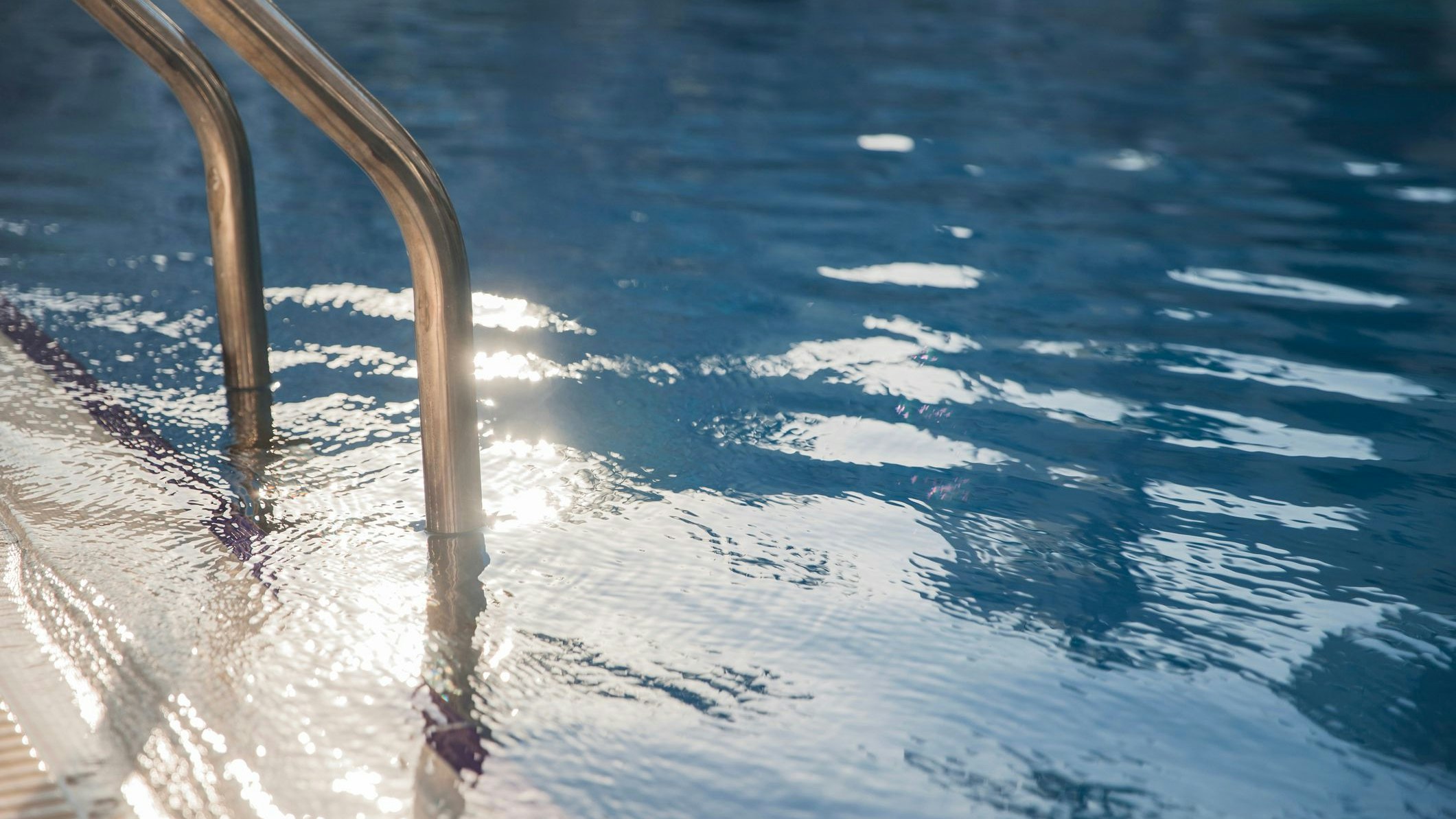 Swimming pool stairs going directly into the water