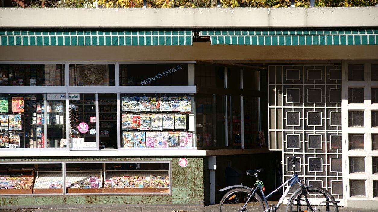 Griesheim, Germany - October 31, 2017: A bicycle parked in front of an old kiosk and newspaper sale on October 31, 2017 in Griesheim.