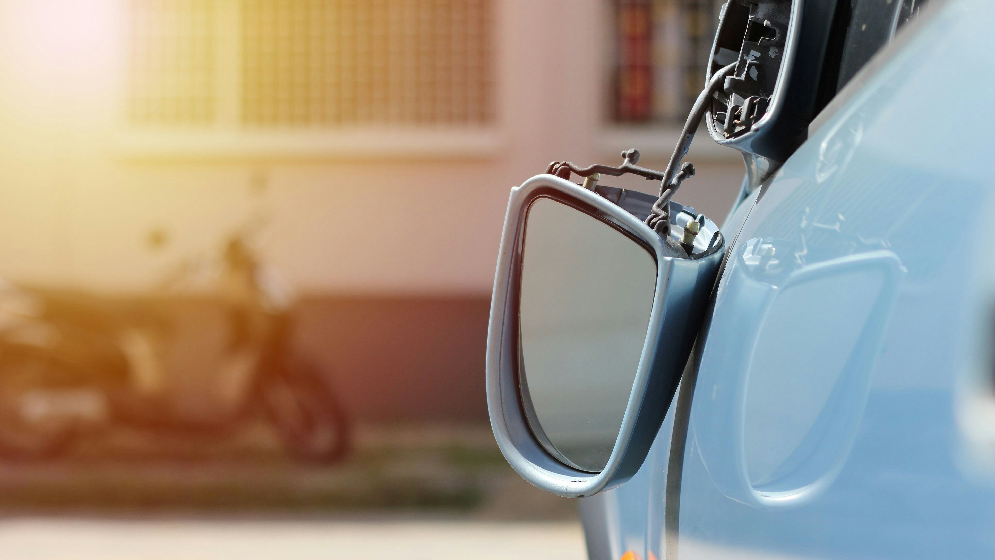 Close up car wing mirror, side view mirror broken from accident. Car insurance concept.
