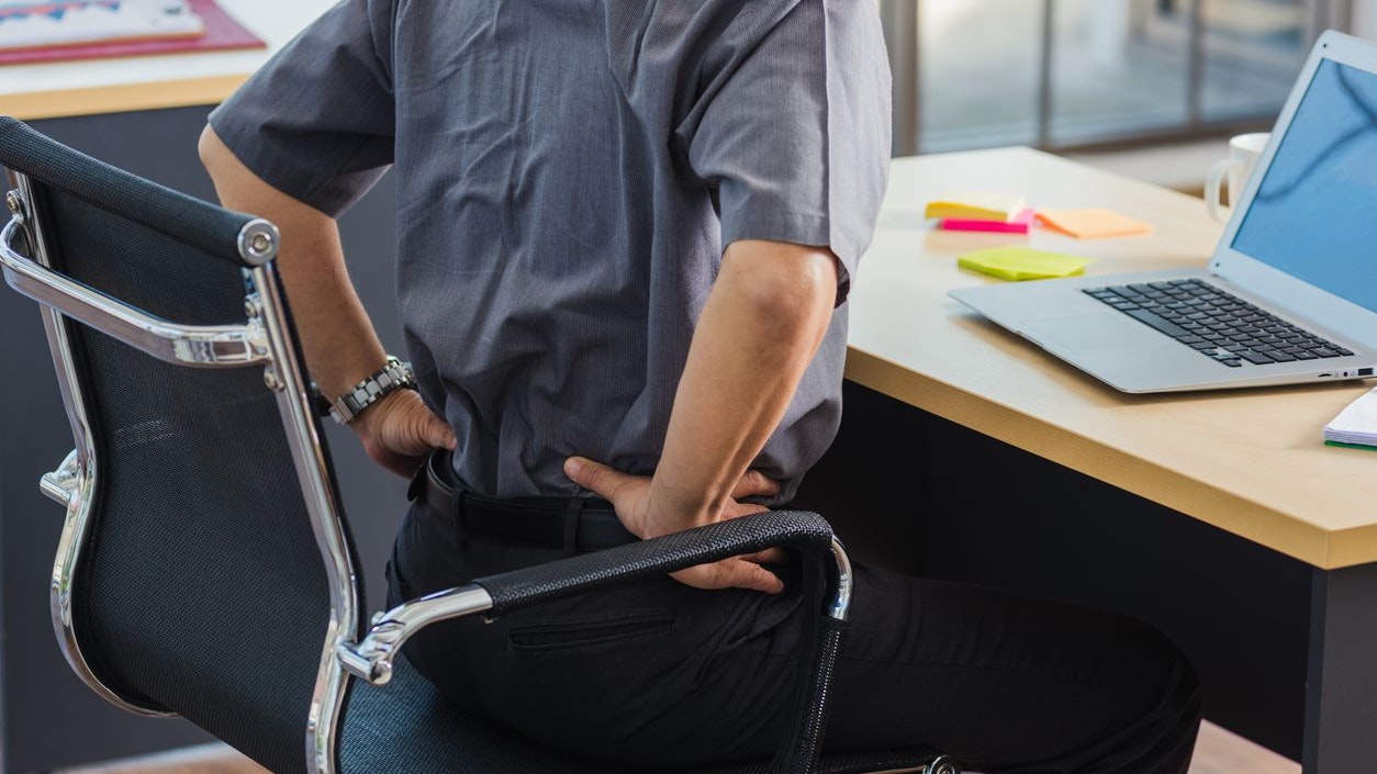 Asian hard senior businessman working with laptop computer has a problem with back pain. Old man feeling pain after sitting at desk long time, Healthcare and medicine office syndrome concept