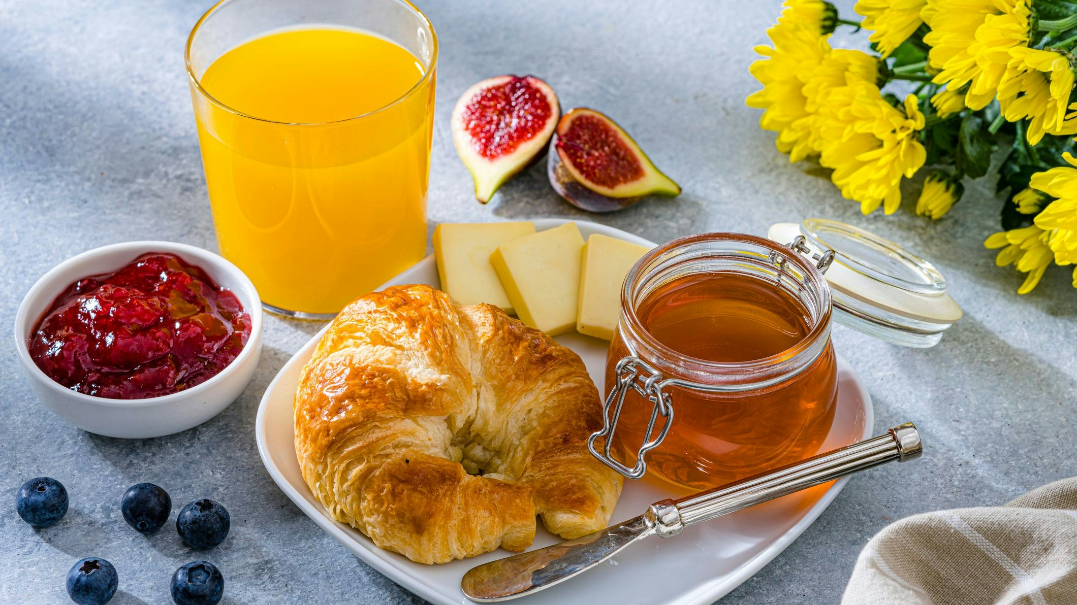 Sweet meal of croissant and honey.