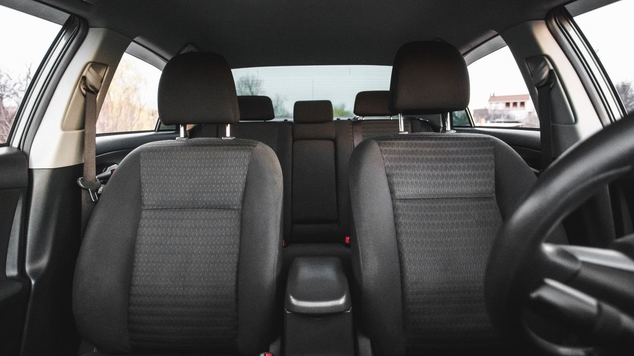 Car interior, part of front seats, close