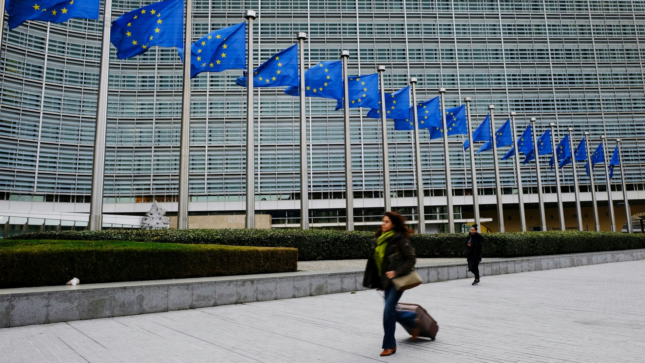 Pedestrians walk outside of the European Commission's Berlaymont building in Brussels, Belgium on Oct. 31, 2018