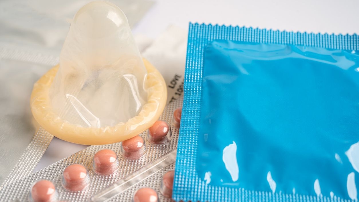 Birth control pills and condom, contraception health and medicine.