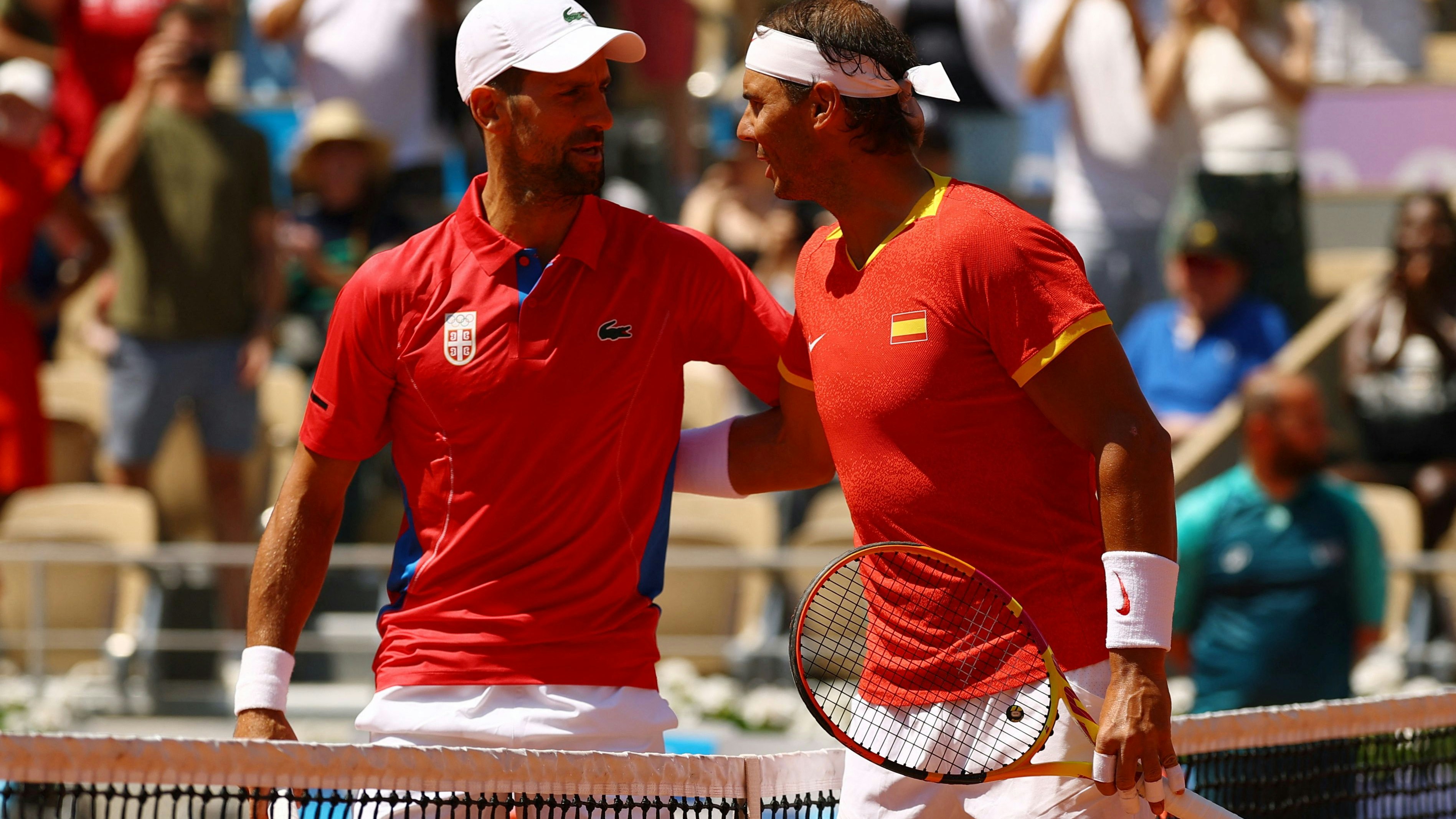 Paris 2024 Olympics - Tennis - Men's Singles Second Round - Roland-Garros Stadium, Paris, France - July 29, 2024. Rafael Nadal of Spain and Novak Djokovic of Serbia pose before their match. REUTERS/Kai Pfaffenbach
