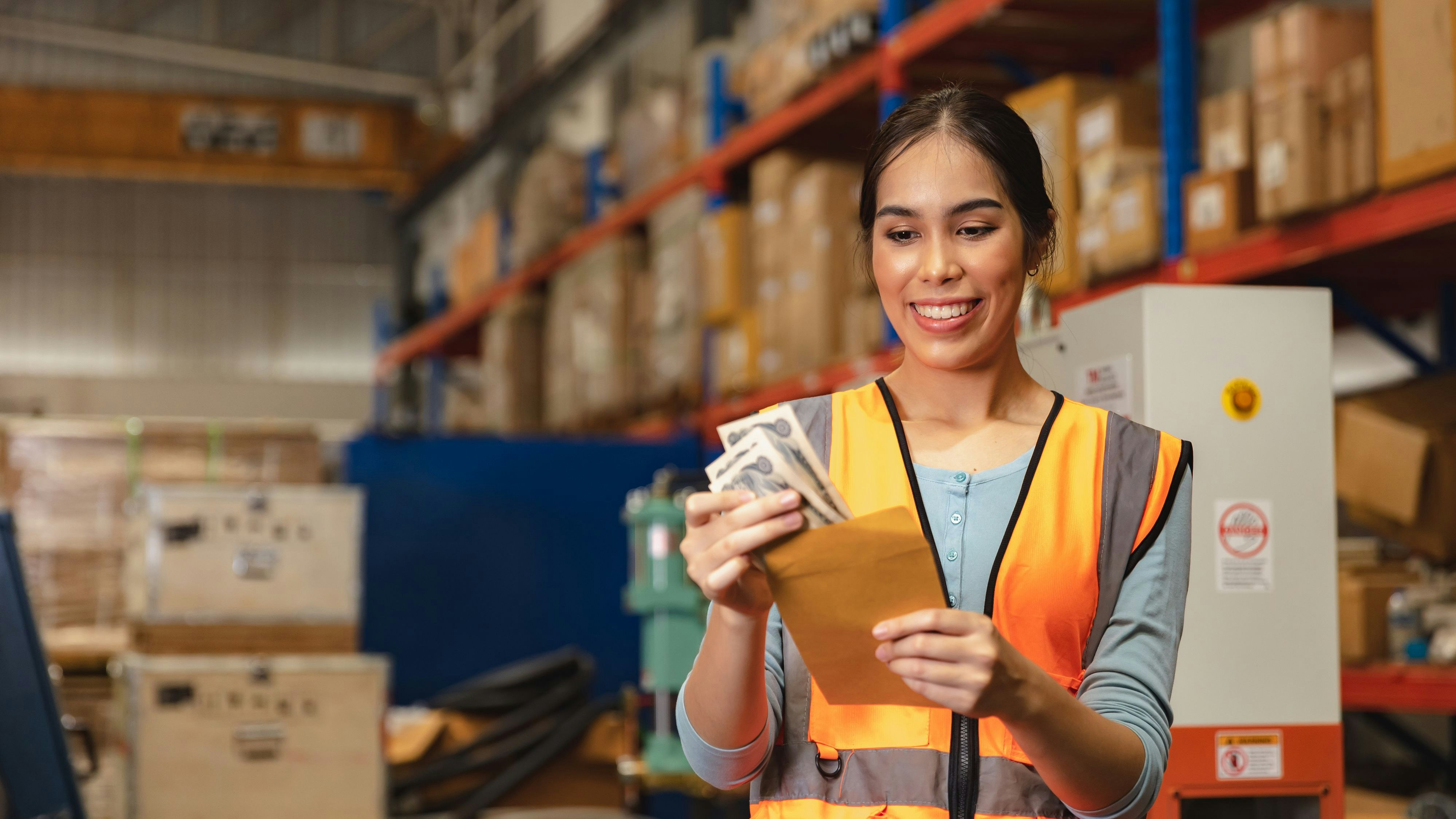 Worker employee recieve salary with working overtime bonus money payday work in factory warehouse