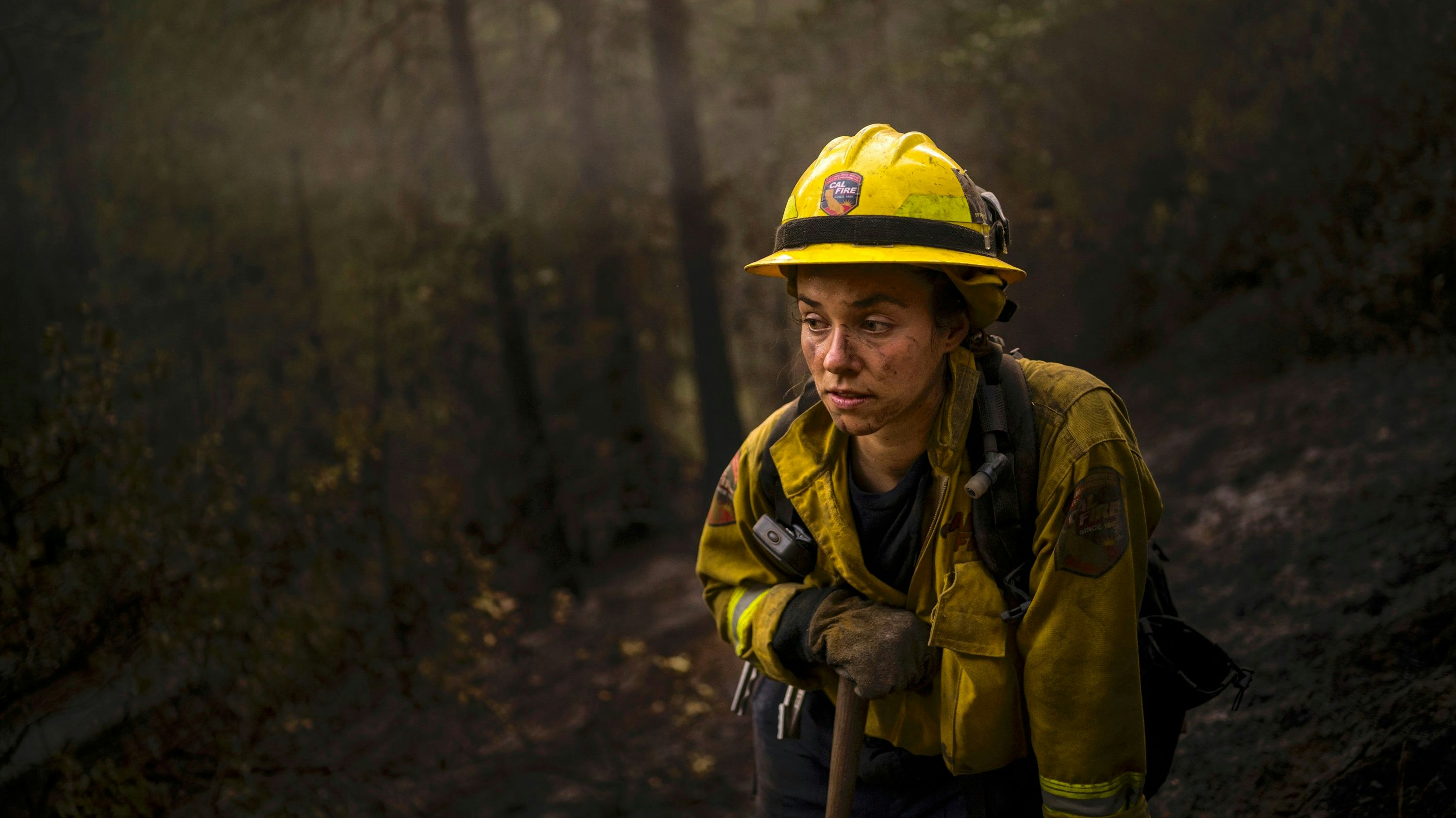 Madalyn Schiffel, 26 takes a break during a long day fighting fires that burned overnight near West Point Station in California, September 2021. 