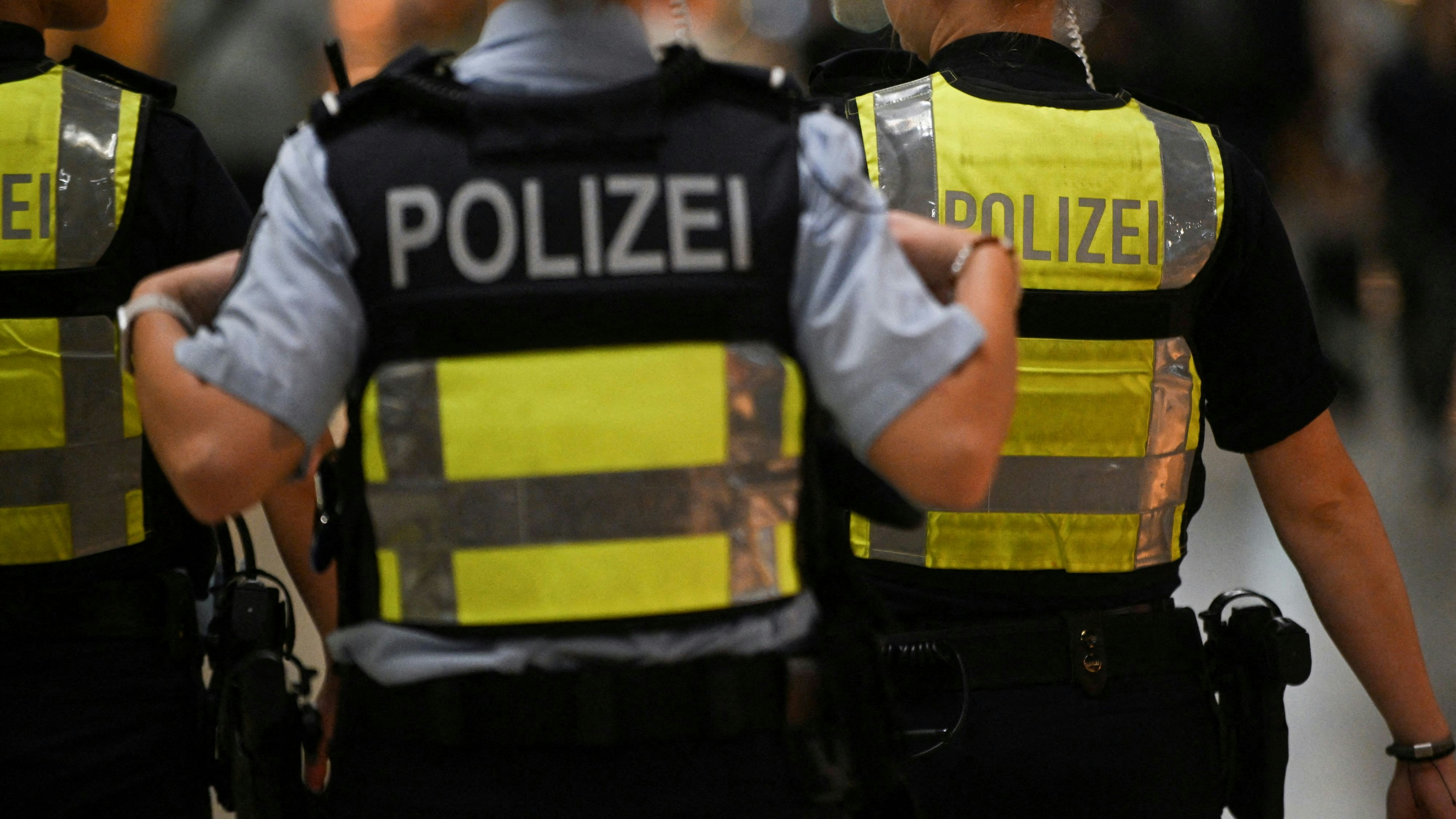 Police walk on the day activists of the "Letzte Generation" (Last Generation) protest for a change in climate policy at the Cologne-Bonn airport in Cologne, Germany July 24, 2024. REUTERS/Jana Rodenbusch