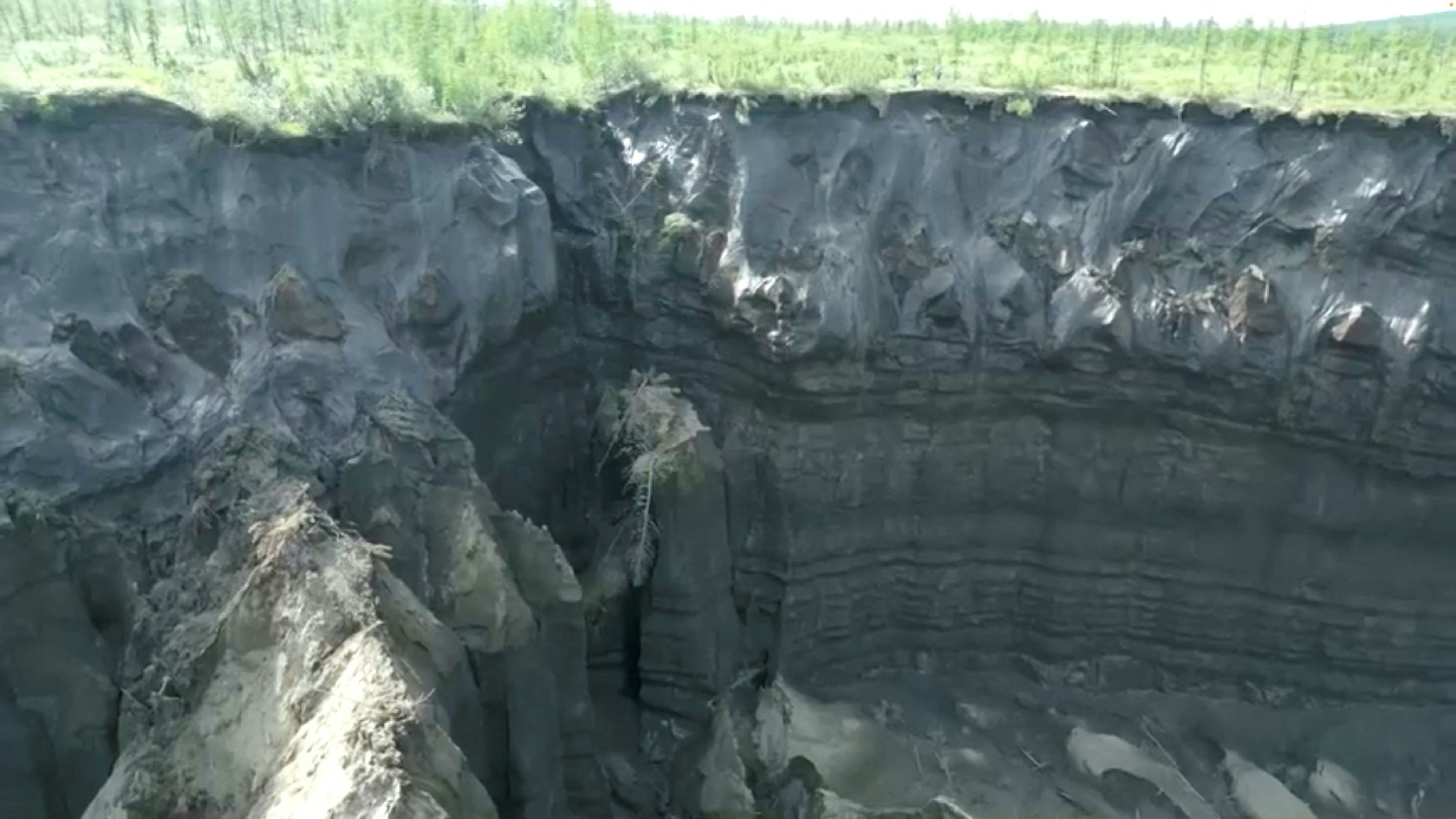 A view of the Batagaika crater, as permafrost thaws causing a megaslump in the eroding landscape, in Russia's Sakha Republic in this still image from video taken July 11 or 12, 2023. Reuters TV via REUTERS