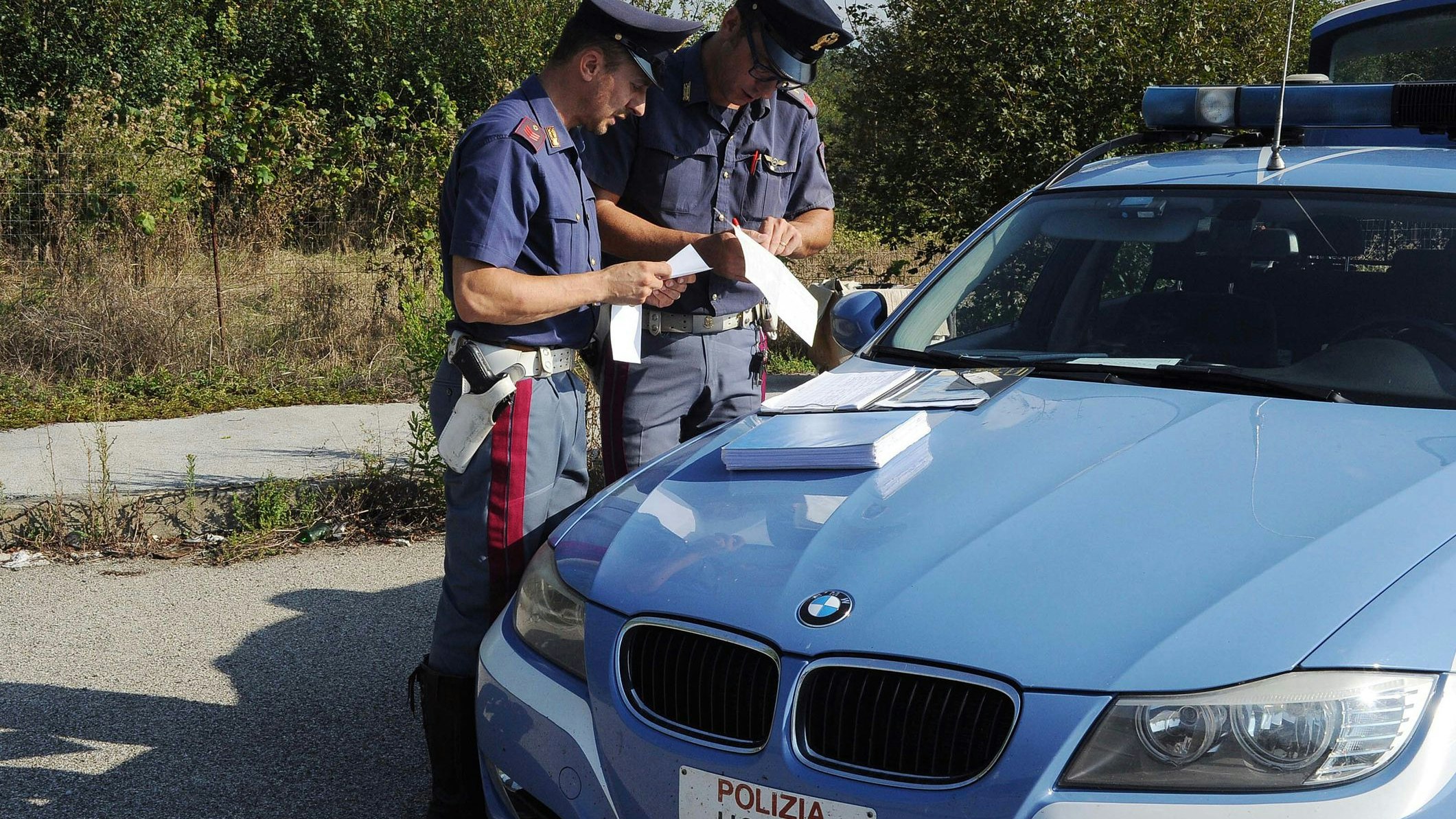 Arezzo (Italy), November 1, 2016. Roadside checks by traffic police officers for drunk driving licenses with patrol cars. Minutes and fines are issued for drivers who are not in compliance.