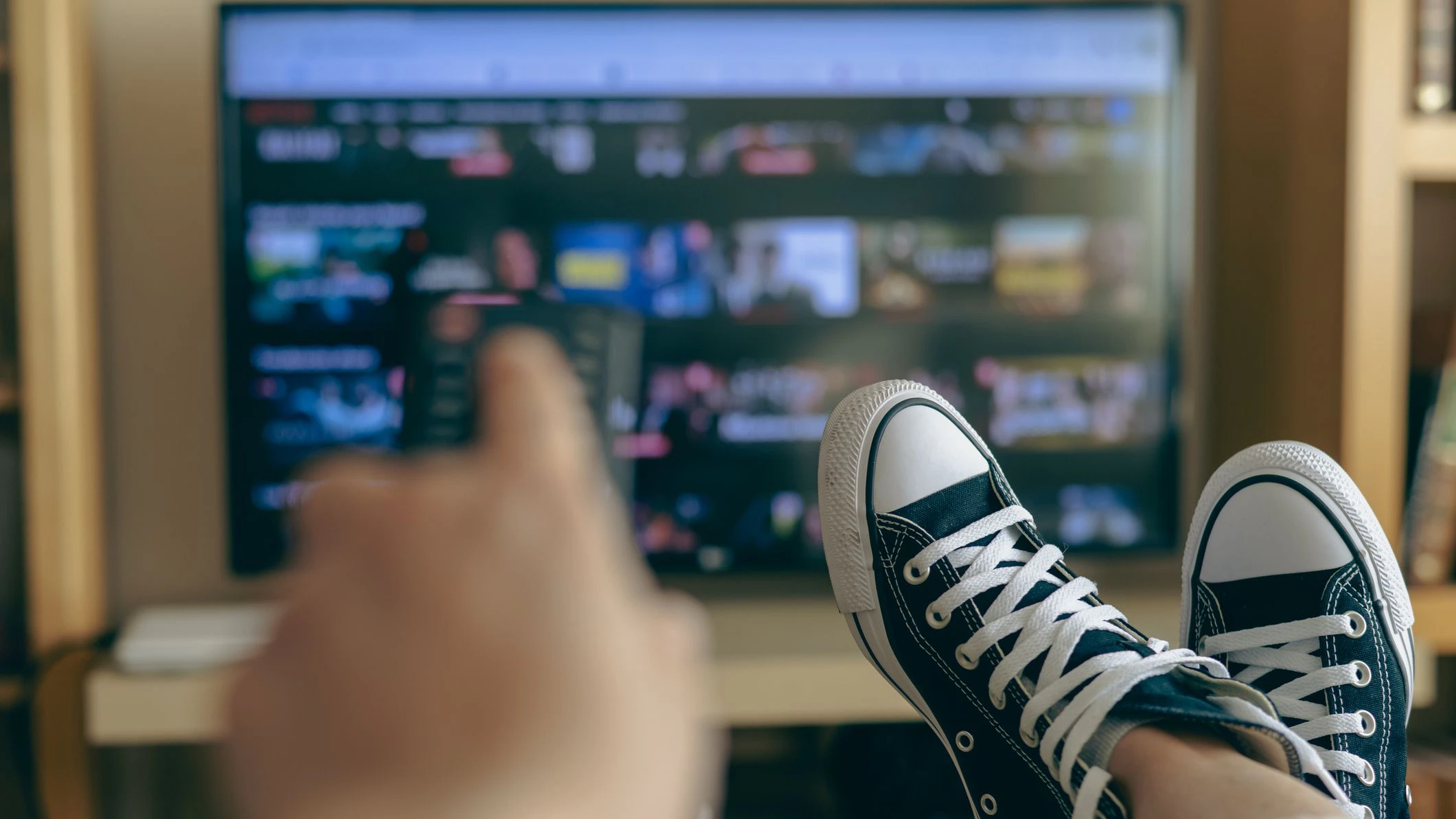 Relaxed Person At Home Watching TV. Video Streaming Concept