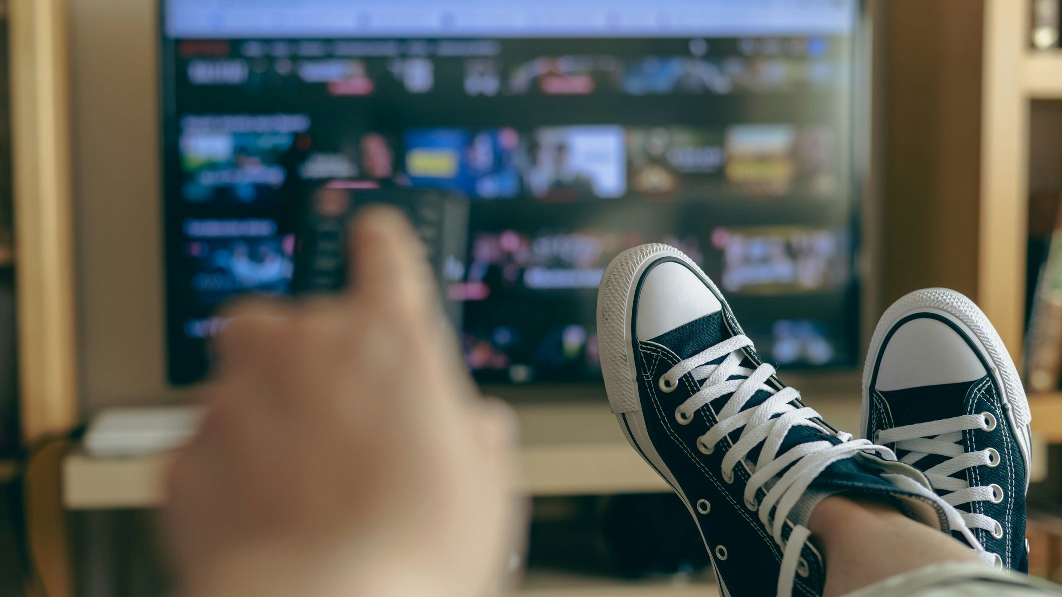 Relaxed Person At Home Watching TV. Video Streaming Concept