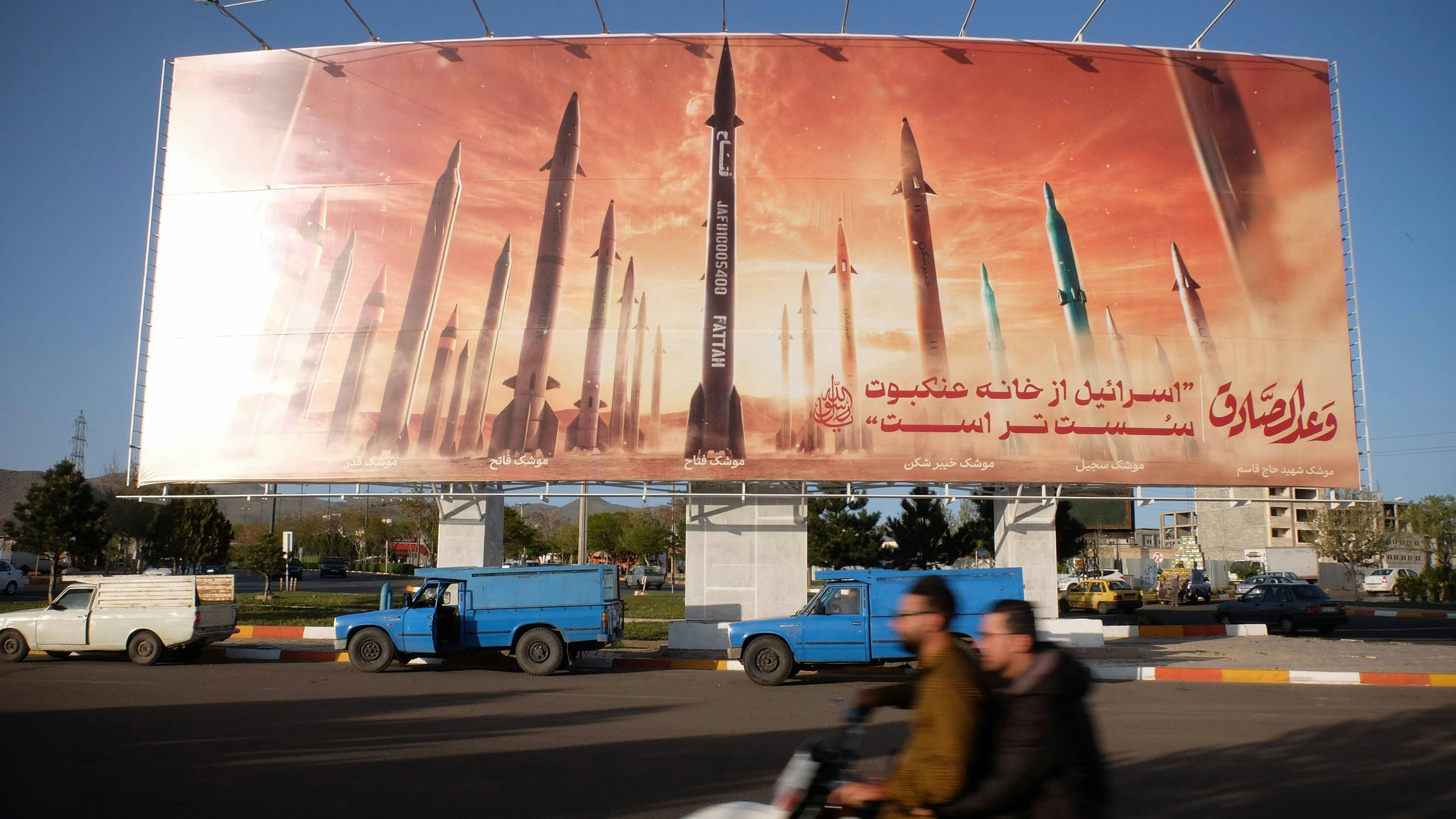 April 25, 2024, Zanjan, Iran: Motorists drive their vehicles past an anti-Israel billboard carrying pictures of Iranian missiles and a sentence reading in Persian, Israel is weaker than spider home in Zanjan, Iran. Tension between Iran and Israel continues since Iran s Islamic Revolutionary Guards Corps IRGC launched drones and missiles towards Israel on 13 April 2024, following an airstrike on the Iranian embassy in Syria, which Iran claimed was conducted by Israel. Iranian state media reported that air defense systems destroyed three aerial objects over the central city of Isfahan in the early morning of 19 April 2024. Zanjan Iran - ZUMAf146 20240425_zip_f146_009 Copyright: xRouzbehxFouladix