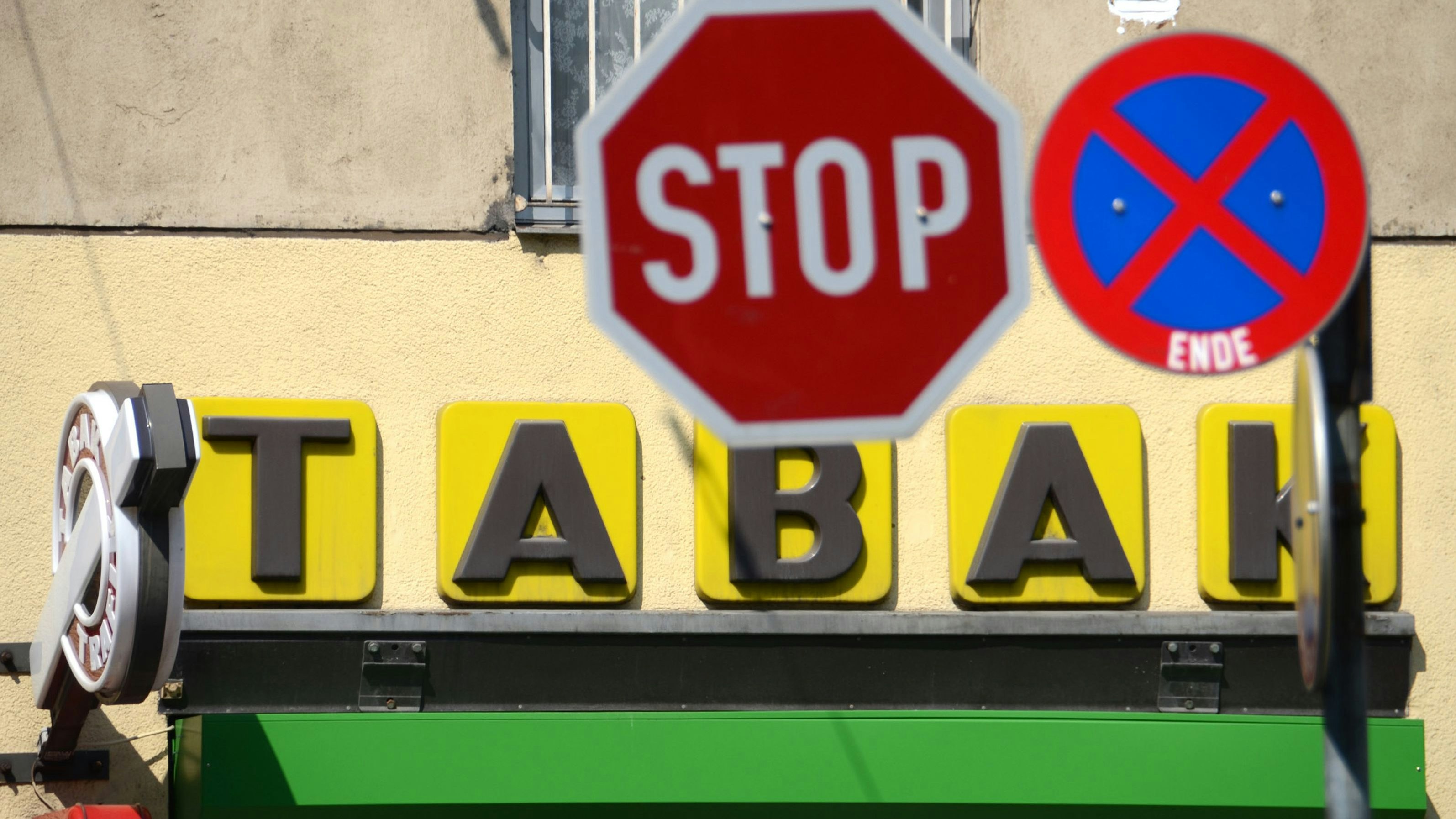 Stop sign in front of a tobacco shop in Austria, Europe