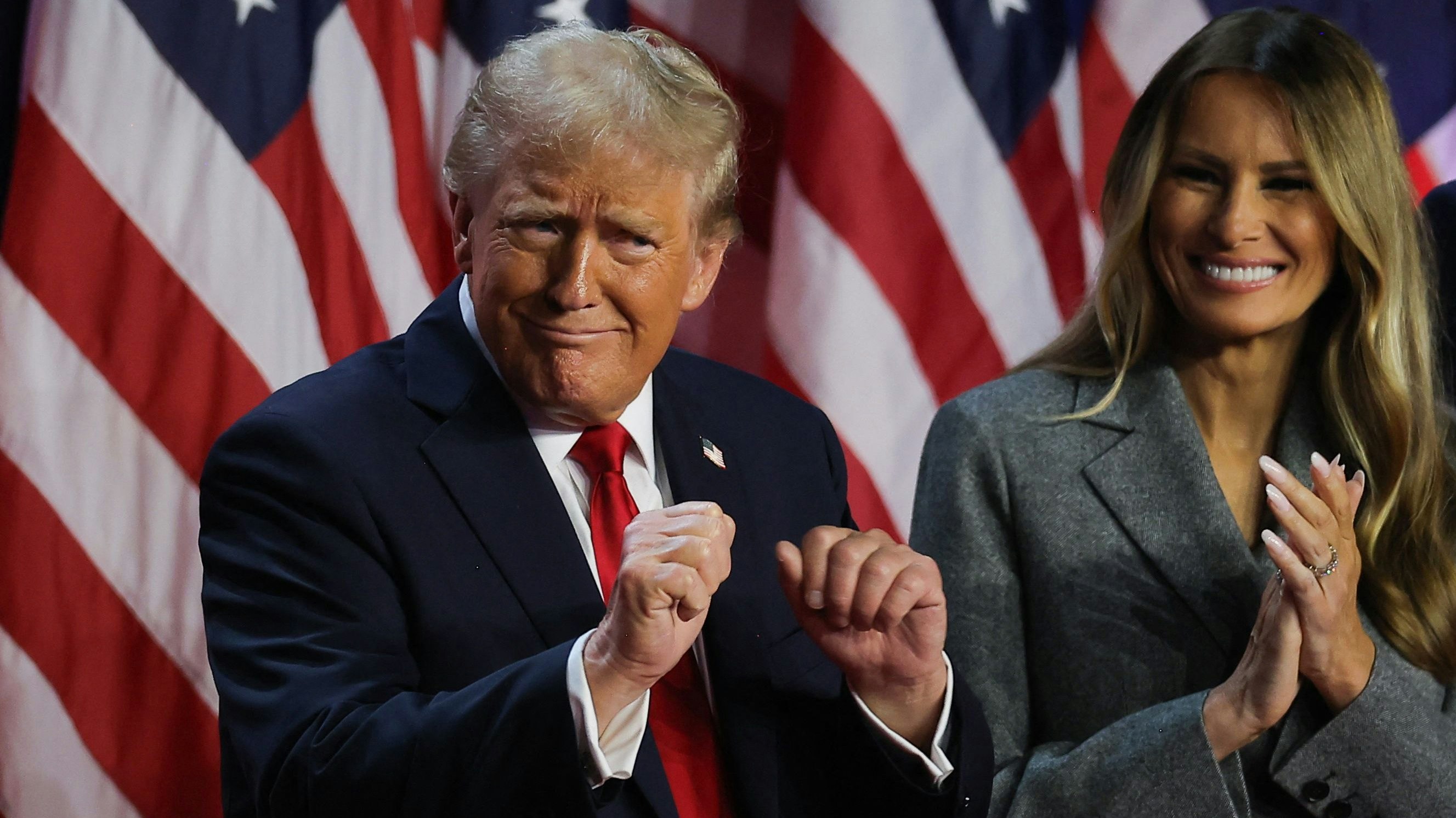 Republican presidential nominee and former U.S. President Donald Trump dances accompanied by Melania Trump, after speaking following early results from the 2024 U.S. presidential election in Palm Beach County Convention Center, in West Palm Beach, Florida, U.S., November 6, 2024. REUTERS/Carlos Barria