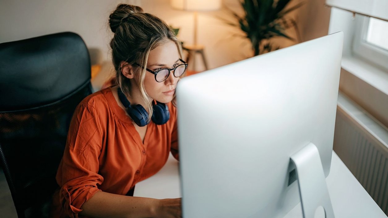 Women analysing data on computer