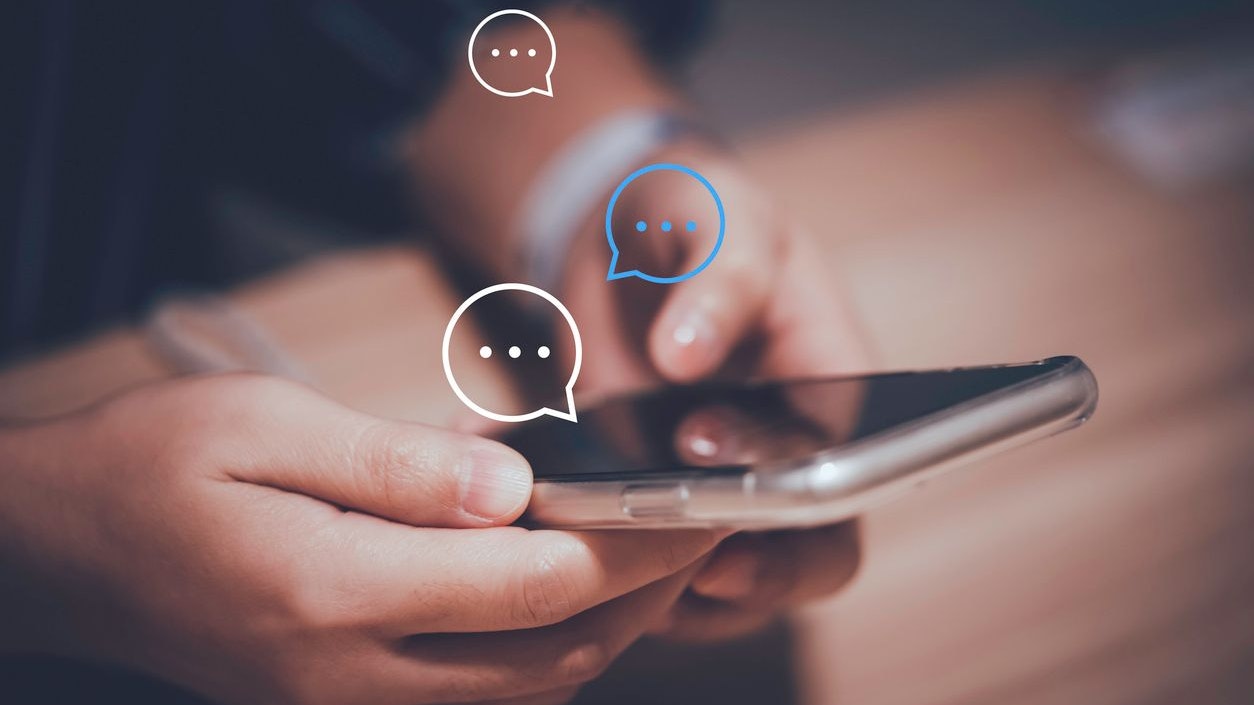 Businessman using smartphone typing to send message to colleague , Communication by chat and social network technology concept.