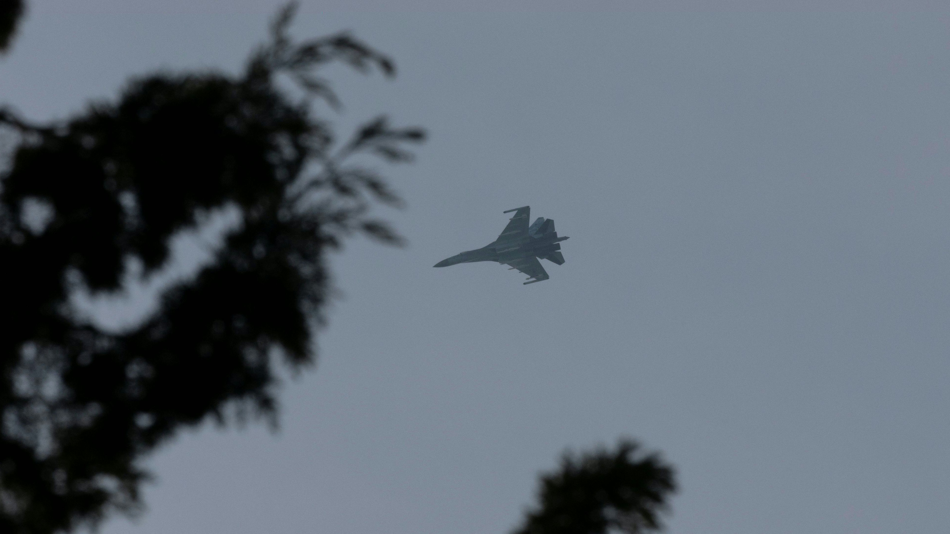 A Russian fighter jet flies over Hmeimim air base in Syria's coastal Latakia, Syria, December 15, 2024. REUTERS/Umit Bektas