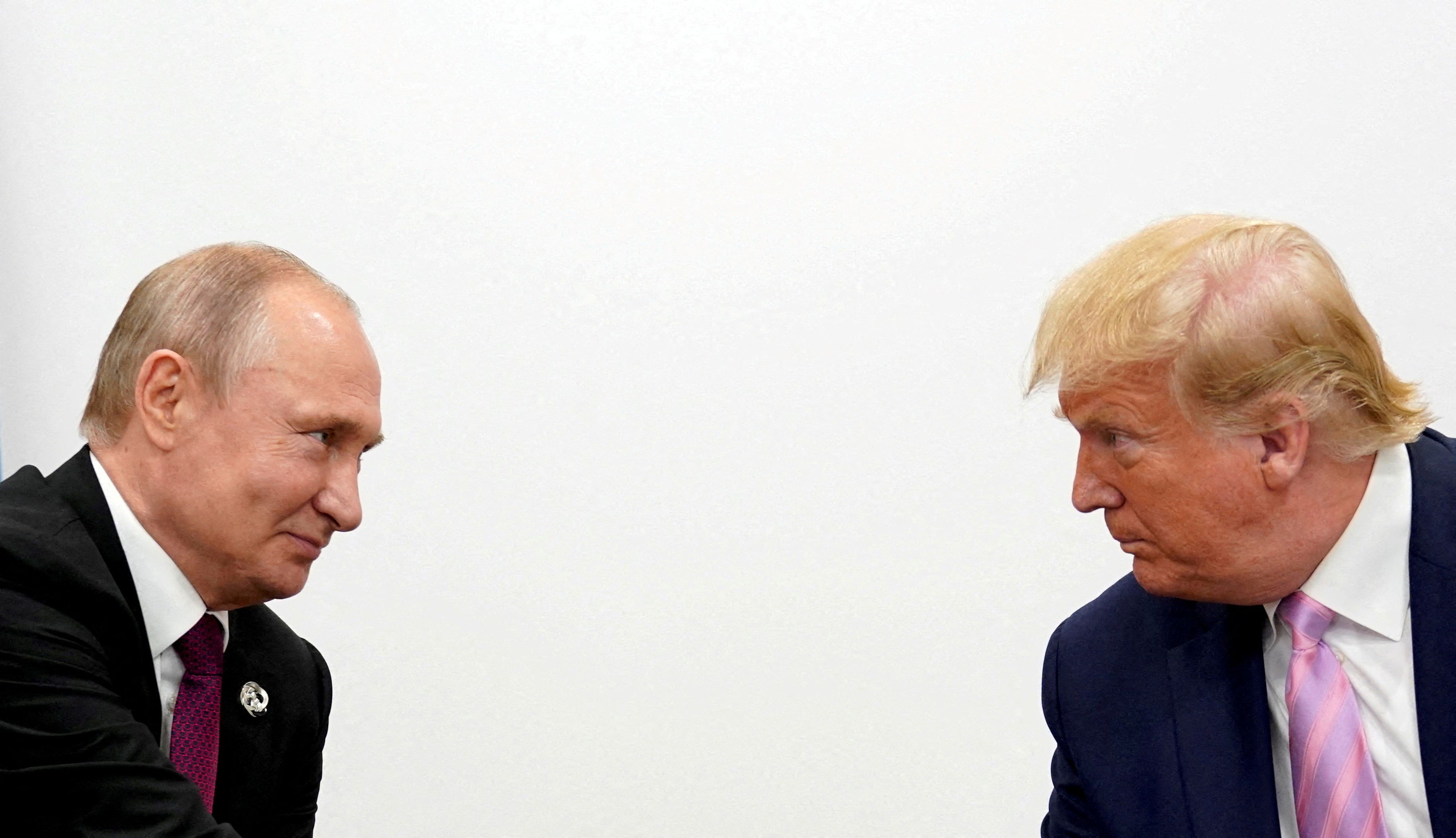 FILE PHOTO: U.S. President Donald Trump and Russian President Vladimir Putin hold a bilateral meeting at the G20 leaders summit in Osaka, Japan June 28, 2019.  REUTERS/Kevin Lamarque/File Photo