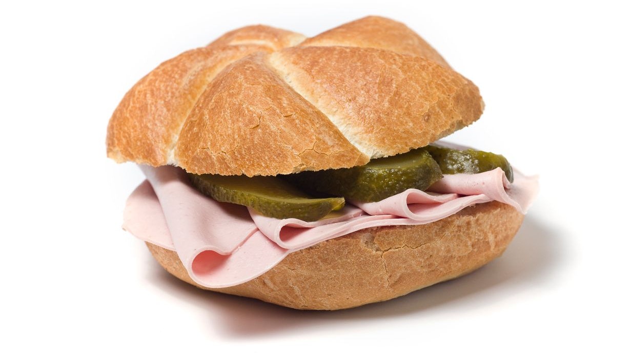 Bun with sausage, typical austrian snack, isolated on white; 