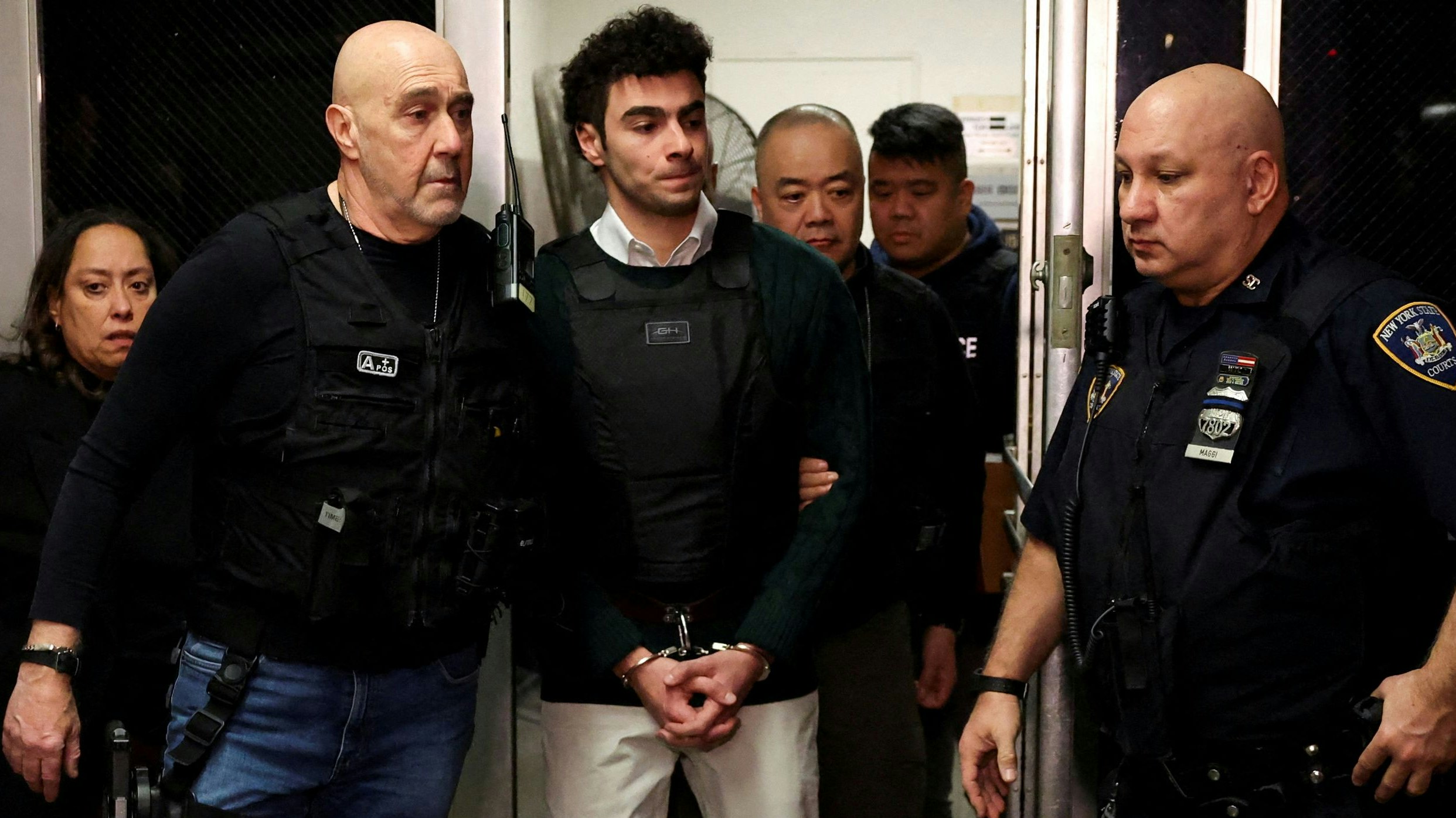 Luigi Mangione, the suspect in the killing of UnitedHealth Group chief executive Brian Thompson, appears for a hearing in Manhattan Criminal Court on New York state murder and terrorism charges in New York City, U.S., February 21, 2025. REUTERS/Brendan McDermid     TPX IMAGES OF THE DAY     