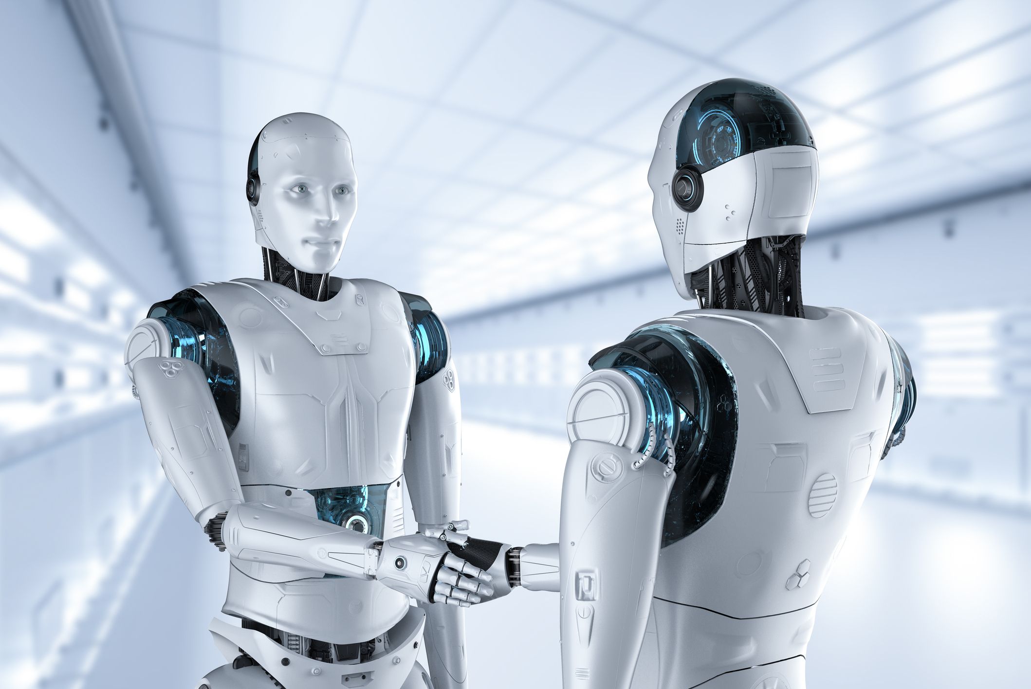 Humanoide Roboter begrüßen einander. (KI-generiertes Symbolbild)