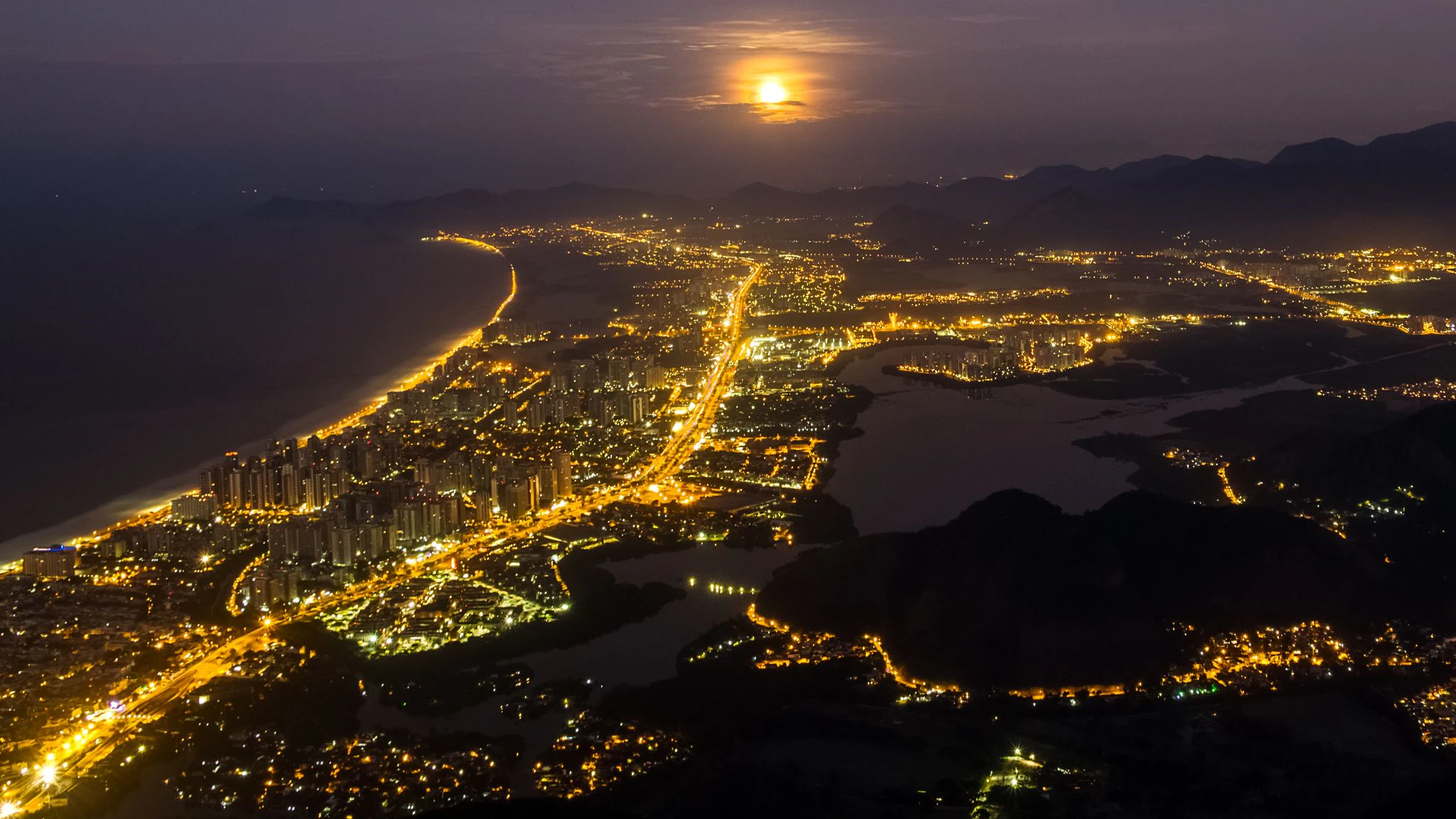 Full moon rising at Rio de Janeiro. Barra da Tijuca district.