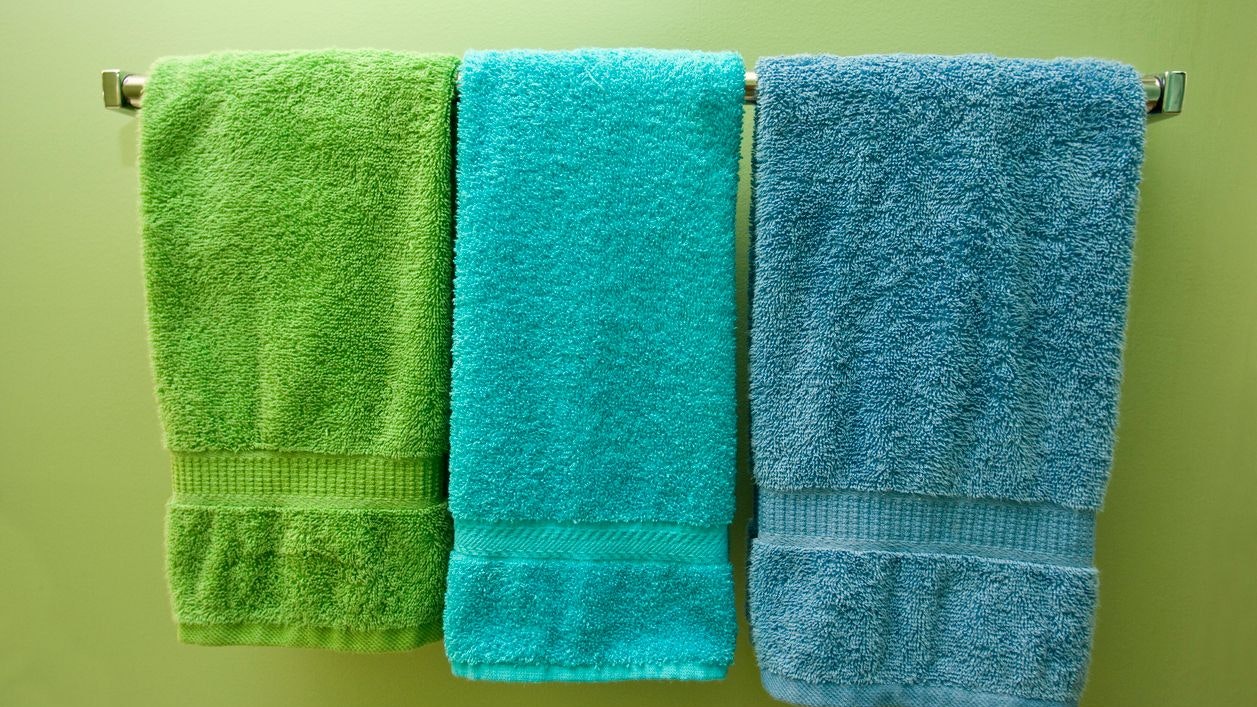 "Multi colored towels in green, blue and turquoise."