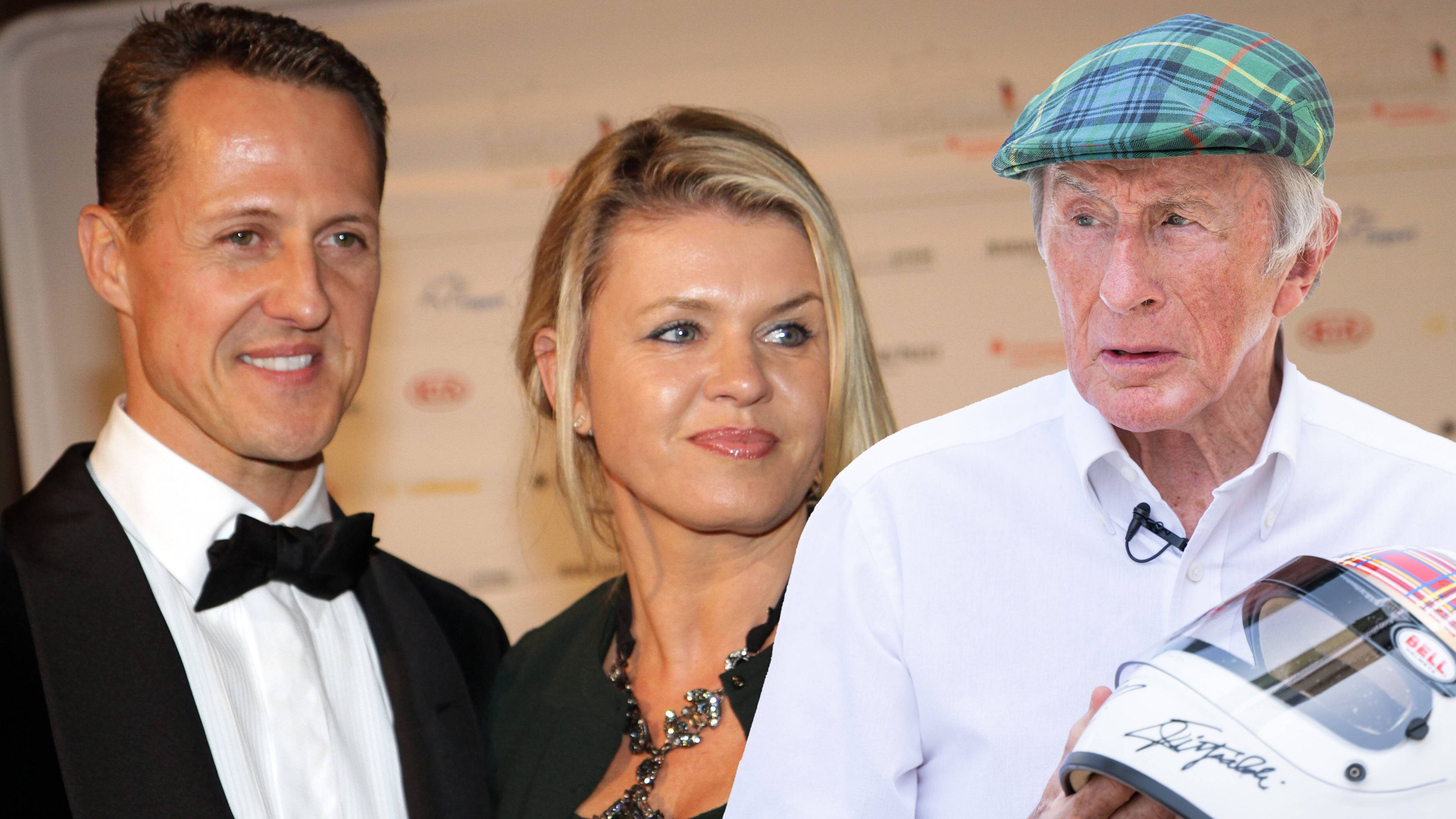 Ehefrau Corinna Schumacher halt ihrem Mann Michael beim Signieren eines Helmes für die Stiftung von Ikone Jackie Steward.