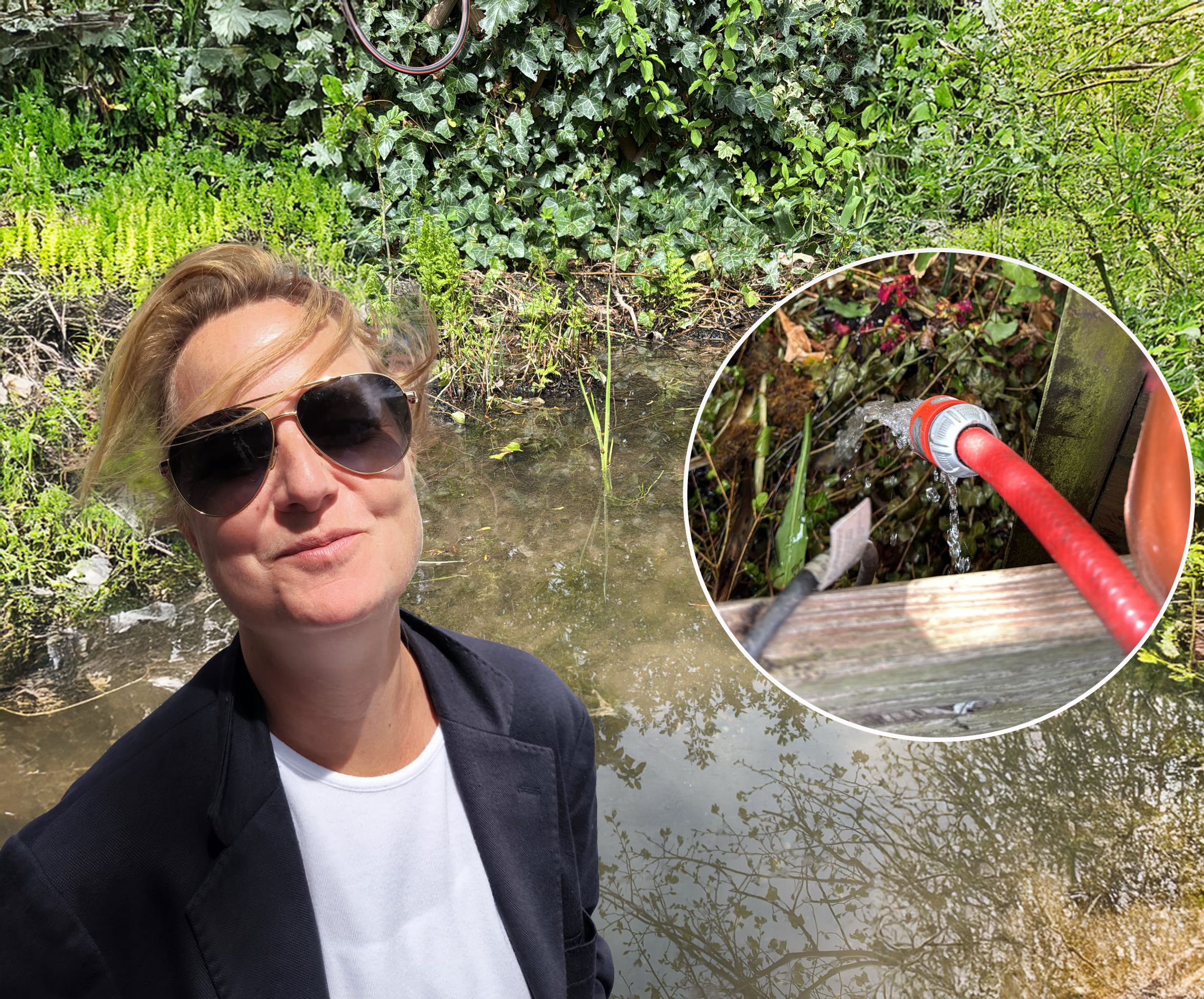 Anna A. (46) kämpft gegen die Wasserflut – mit einem Schlauch leitet sie das Wasser notdürftig vom Grundstück weg.
