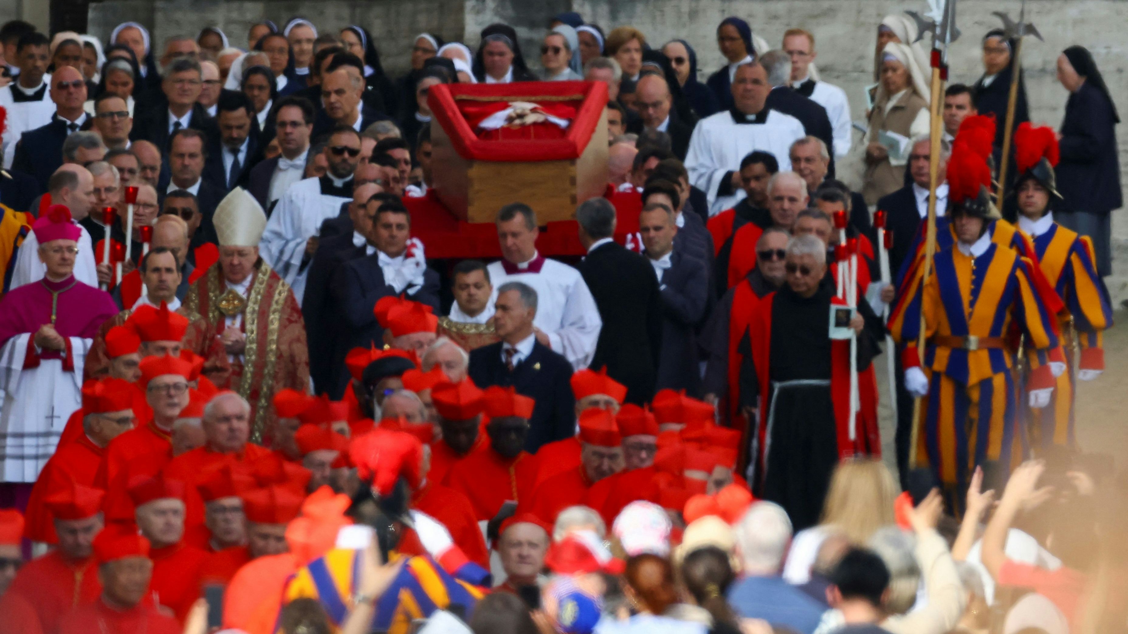 Pope Francis' body is carried in a coffin into Saint Peter's Basilica at the Vatican on the day of its translation, as seen from Rome, Italy, April 23, 2025. REUTERS/Kai Pfaffenbach 