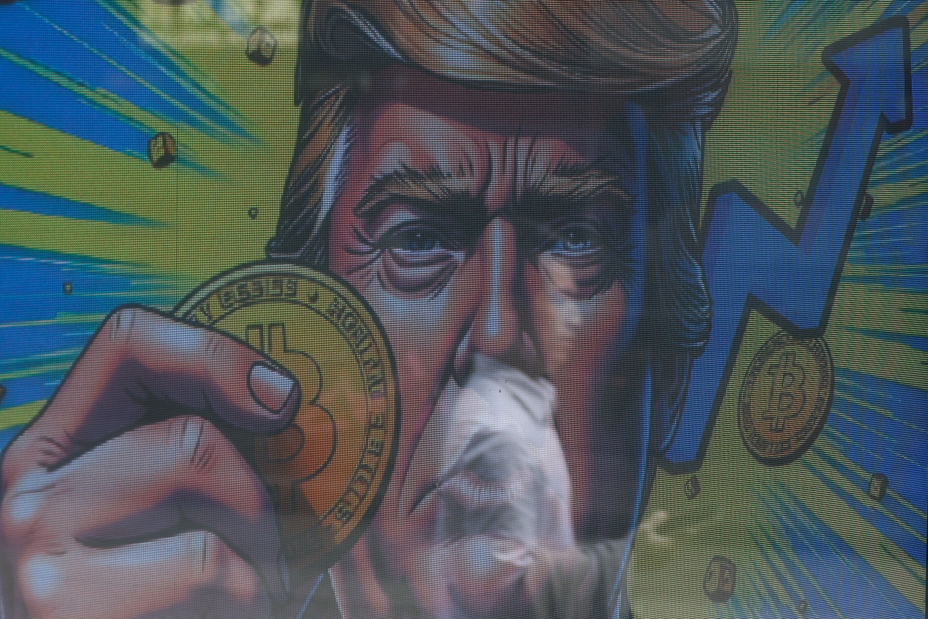 Donald Trump hat eine strategische Bitcoin-Reserve für die USA eingerichtet, die Umsetzung hat die Kryptobranche aber enttäuscht. Im Bild siehst du eine Bitcoin-Werbung in Hongkong.
