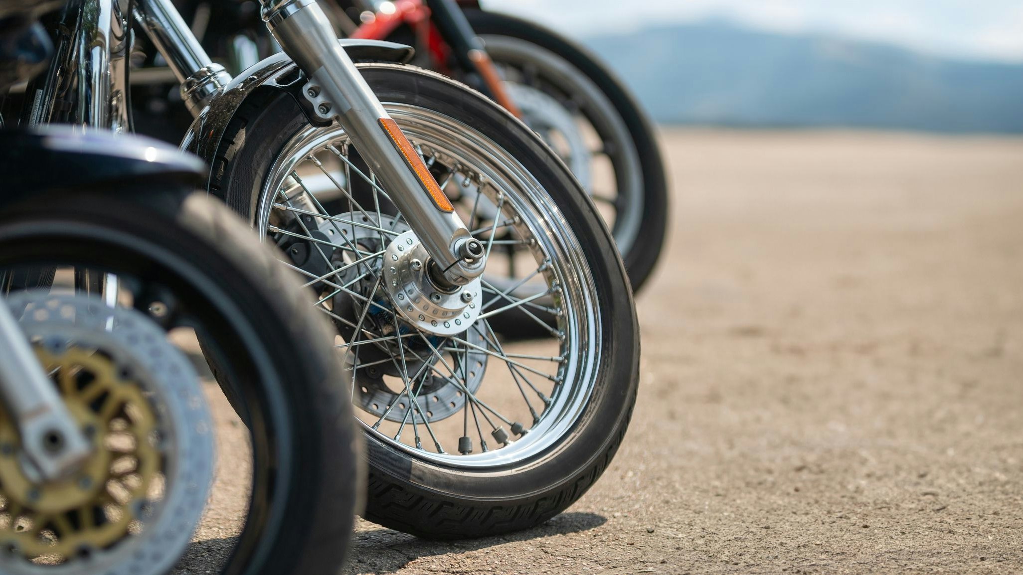 Row of motorcycle bikes in a parking lot