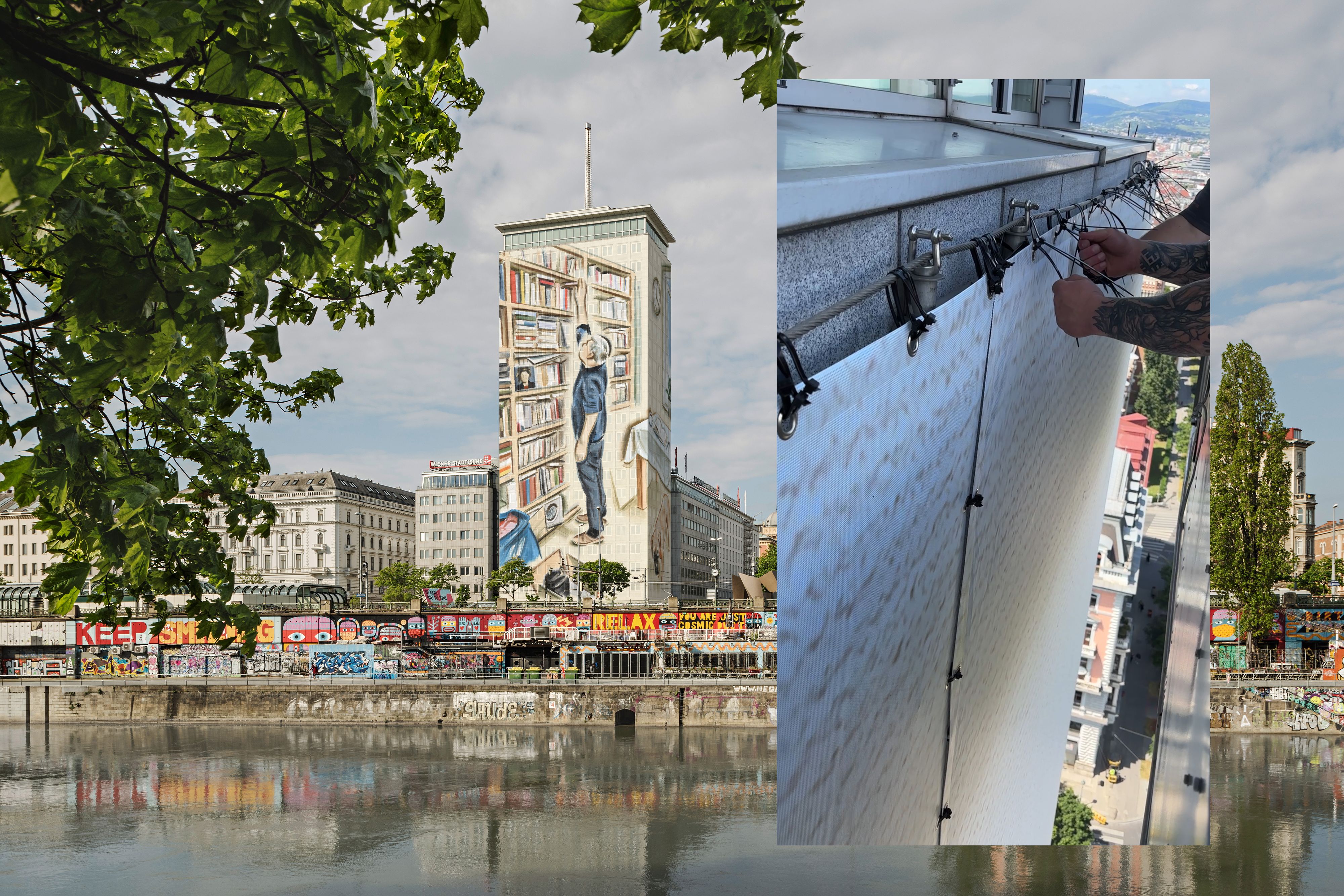 In schwindelerregender Höhe montieren Spezialteams die riesigen bedruckten Planen.