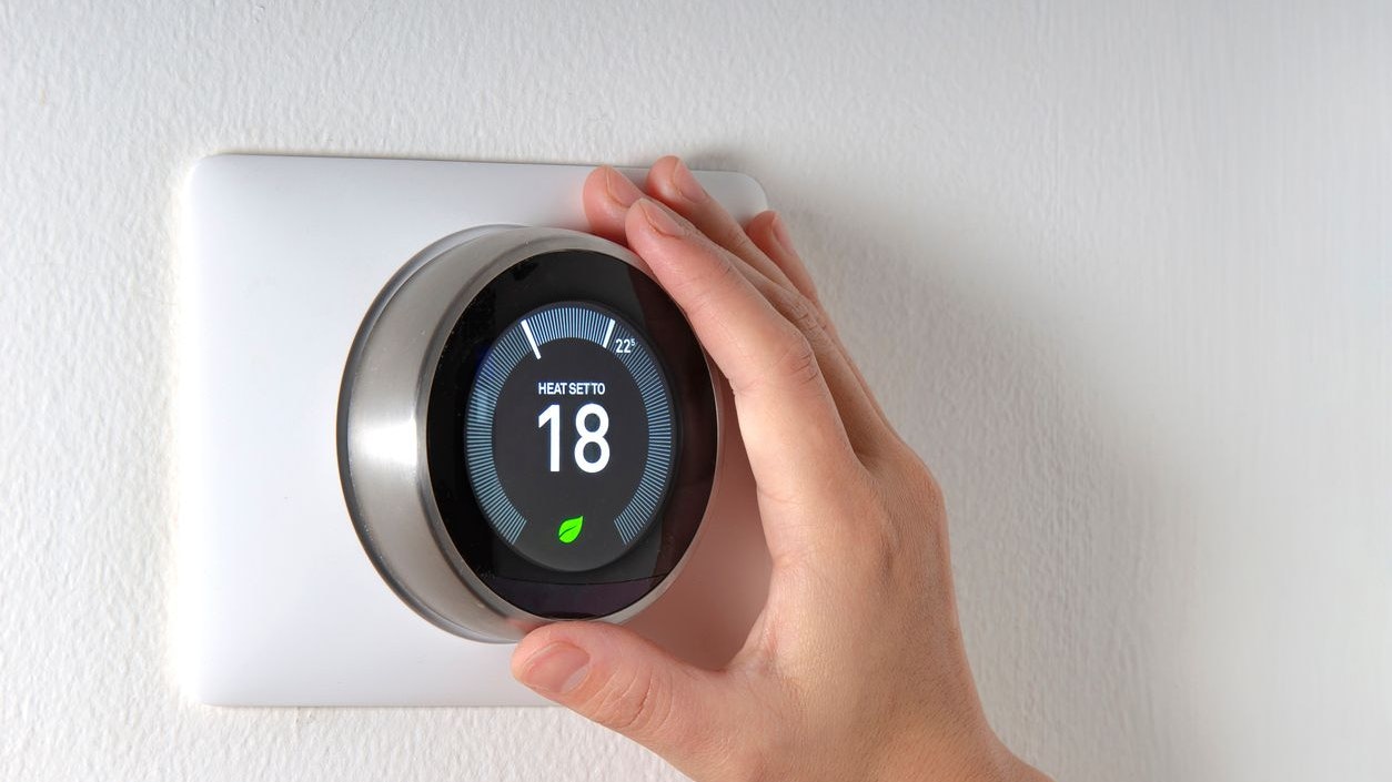 Smart Thermostat with a hand saving energy