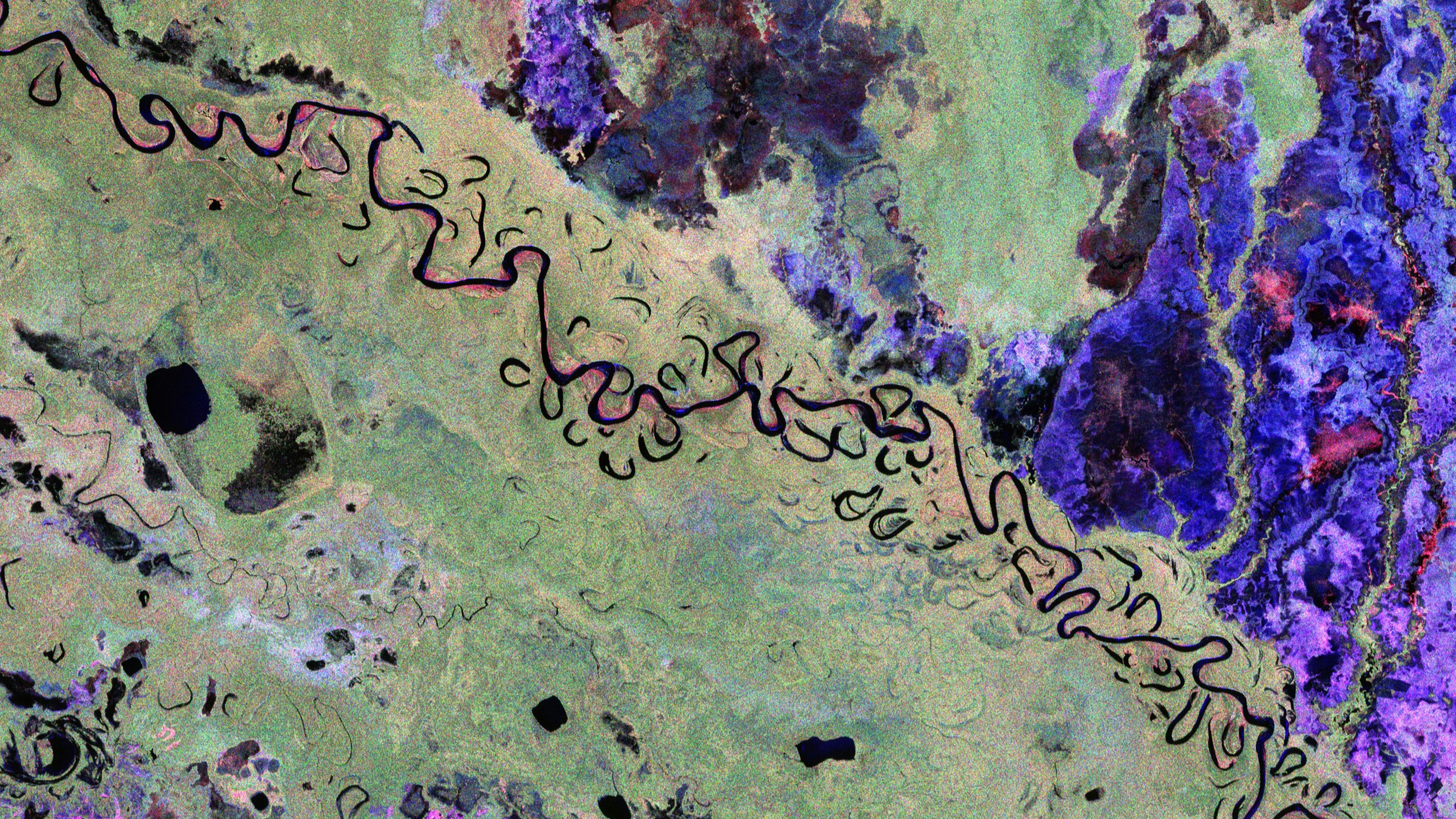 Dieses farbenfrohe Bild zeigt einen Teil von Bolivien. Es wurde unter Verwendung der verschiedenen Polarisationskanäle des Radargeräts erstellt, wobei jede Farbe unterschiedliche Merkmale der Landschaft erkennen lässt. So stehen grüne Farbtöne hauptsächlich für Regenwald, rote Farbtöne für bewaldete Überschwemmungsgebiete und Feuchtgebiete, blau-lila für Grasland und schwarze Bereiche für Flüsse und Seen.