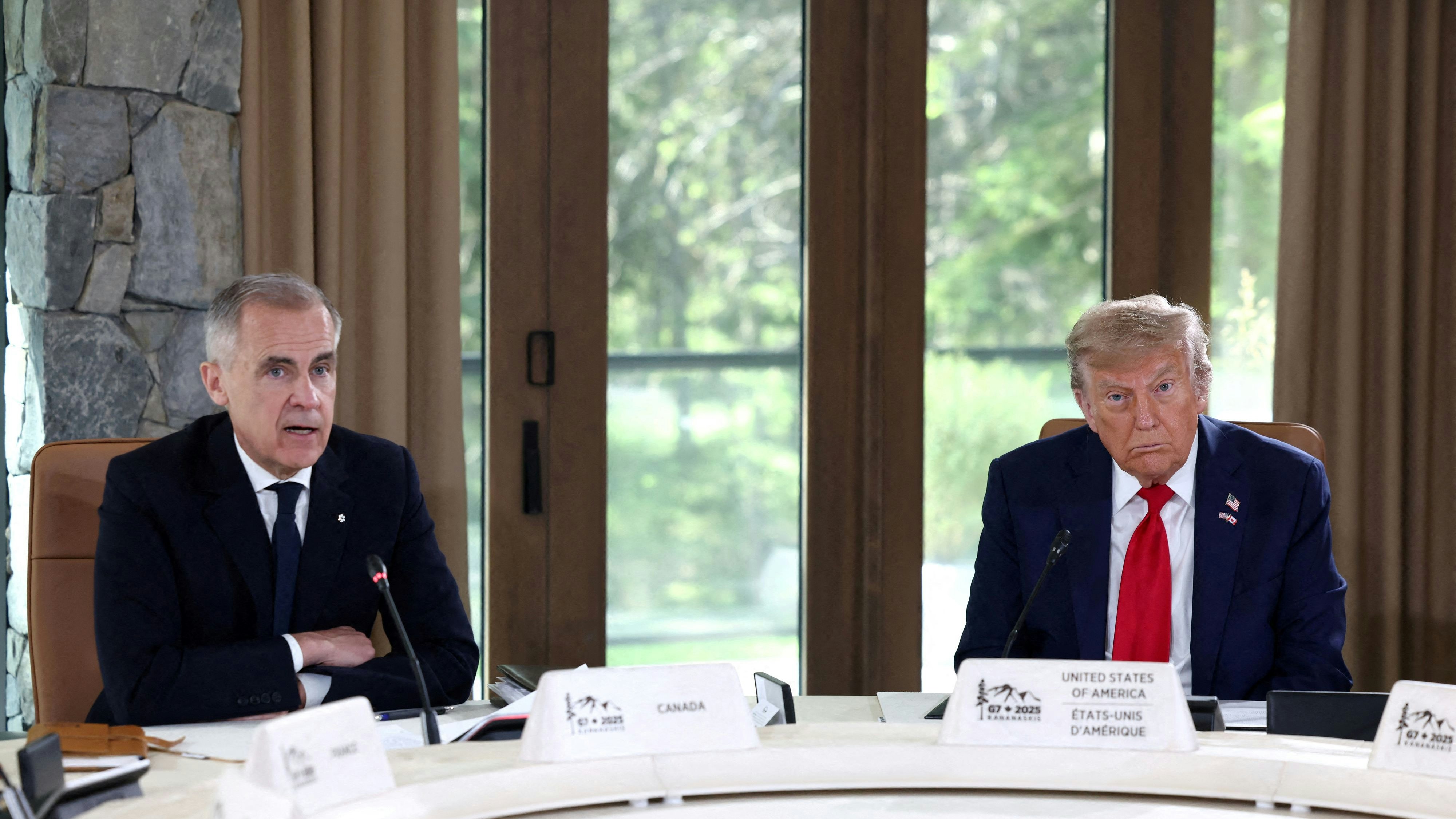 FILE PHOTO: U.S. President Donald Trump and Canadian Prime Minister Mark Carney attend a meeting with G7 leaders and guests, at the G7 summit in Kananaskis, Alberta, Canada,  June 16, 2025.  REUTERS/Kevin Lamarque/File Photo