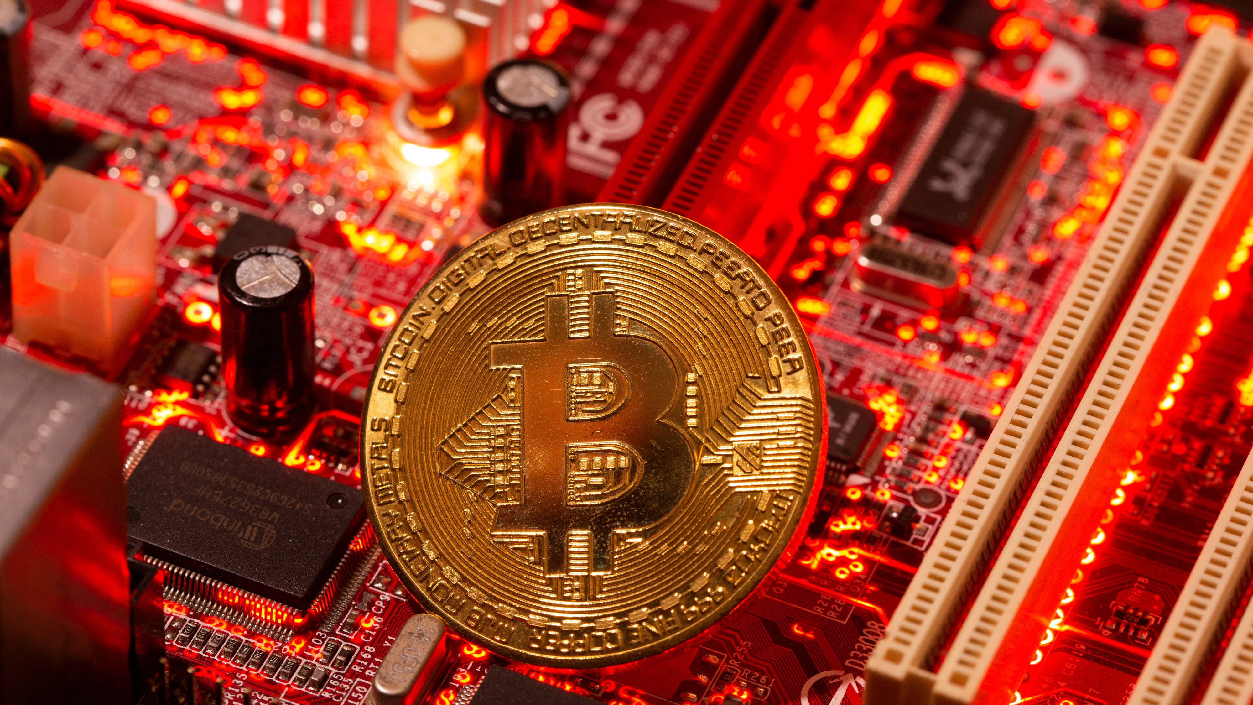 A representation of virtual currency Bitcoin is placed on a computer motherboard in this illustration taken January 21, 2021. REUTERS/Dado Ruvic/Illustration