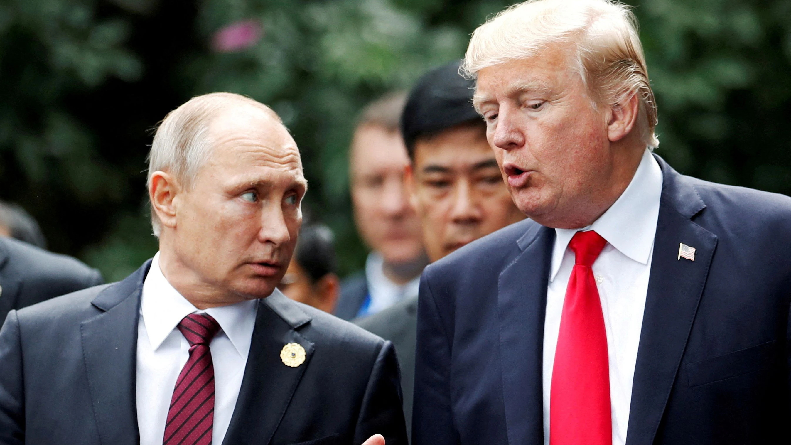 FILE PHOTO: U.S. President Donald Trump and Russia's President Vladimir Putin talk during the family photo session at the APEC Summit in Danang, Vietnam November 11, 2017. REUTERS/Jorge Silva/File Photo