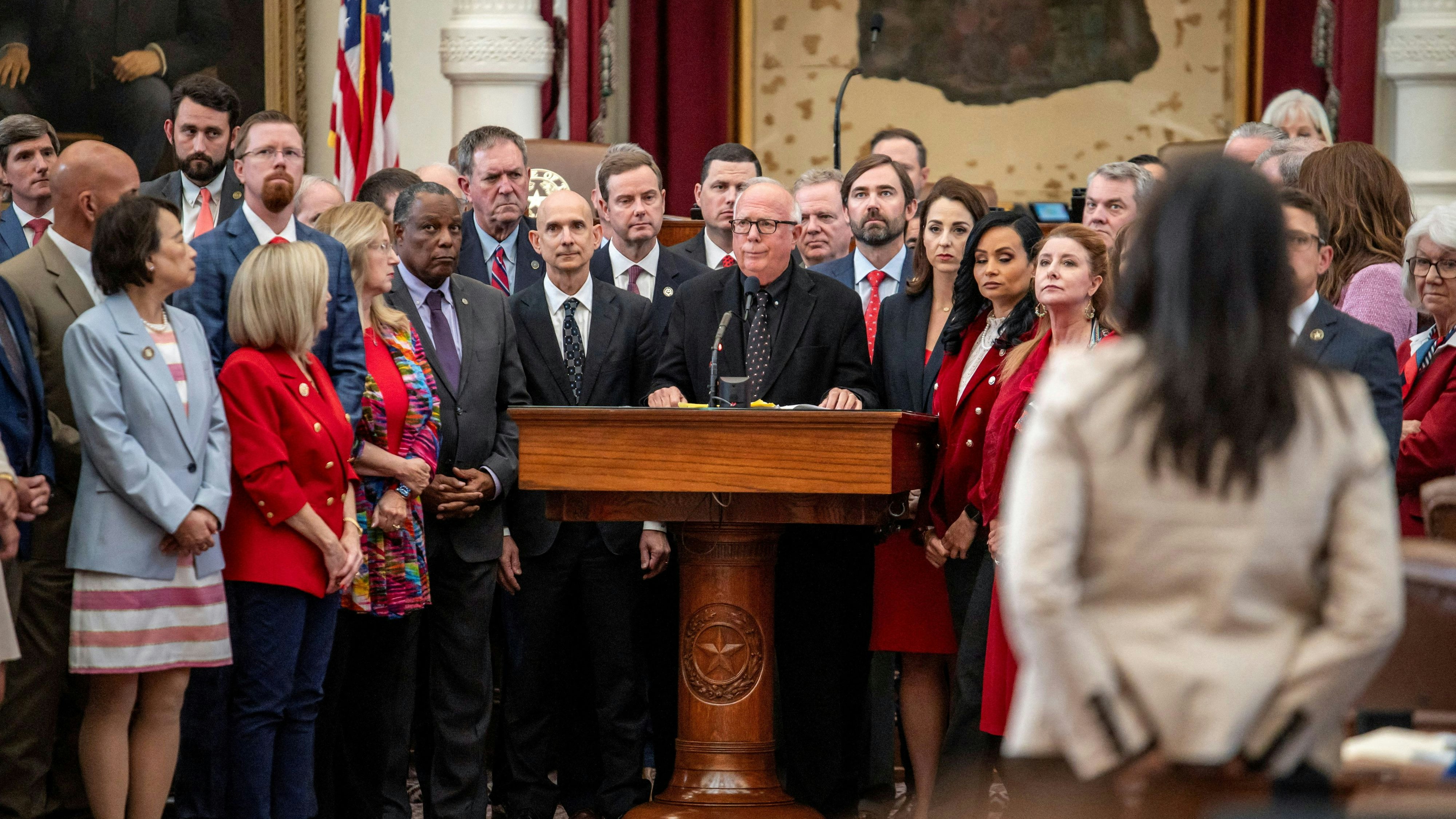 Republican Texas State Representative Todd Hunter, surrounded by most of the Republican members of the House of Representatives, speaks during a session as Democratic lawmakers, who left the state to deny Republicans the opportunity to redraw the state's 38 congressional districts, begin returning to the Texas State Capitol in Austin, Texas, U.S. August 20, 2025. REUTERS/Sergio Flores