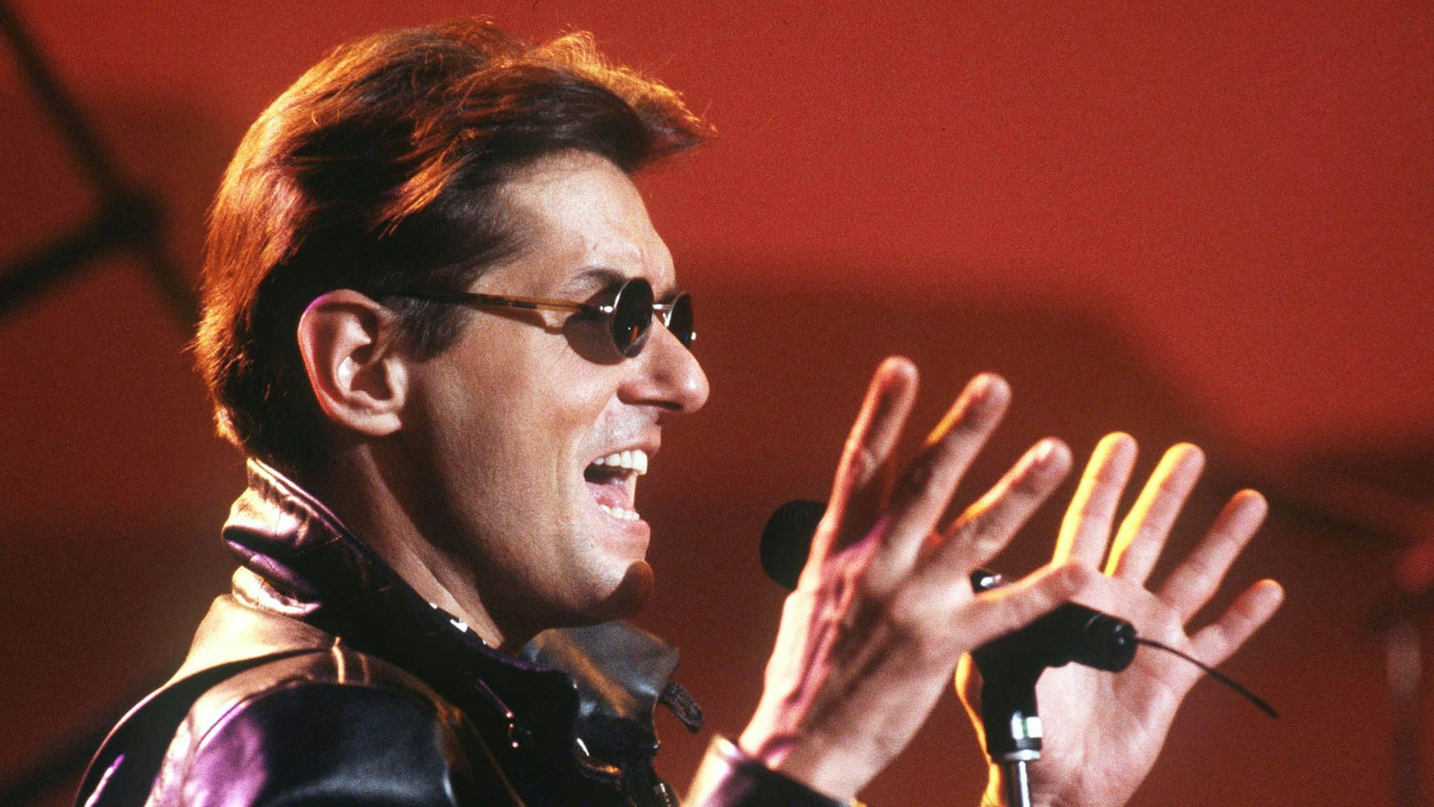 UNDATED FILE PHOTO - Austrian pop singer Hans Hoelzl, known as Falco, performs on stage in this undated file photo. Falco, who led the U.S. charts with his hit "Rock Me Amadeus" for four weeks in 1985, died in a car accident in the Domenican Republic on February 6.