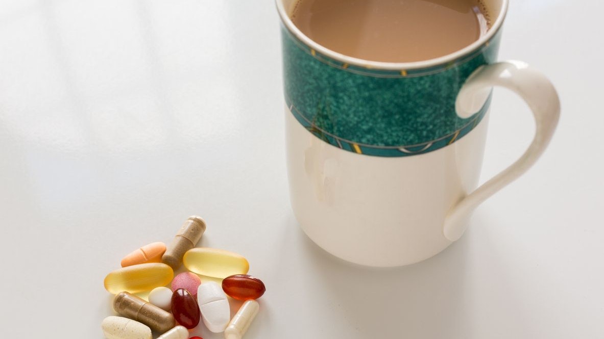 Collection of different colors and sizes of vitamins and supplements taken with breakfast for healthy lifestyle