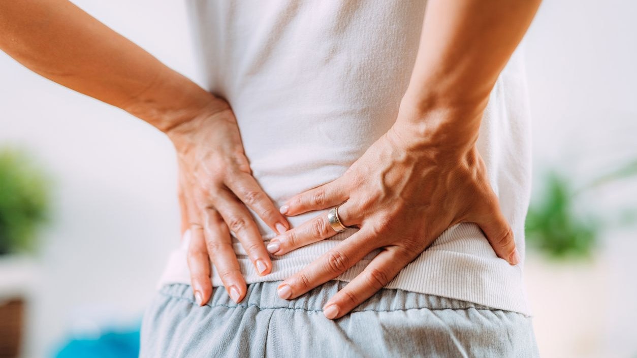 Sciatica or sciatic nerve inflammation, lower back pain. Woman with sciatic nerve pain in her lower back.