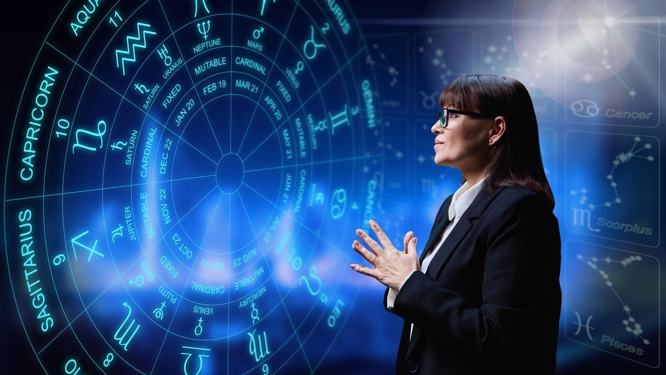 Woman interested in astrology, universe stars astrological wheel background. Horoscope, zodiac signs, predictions, future, astrology exoteric concept