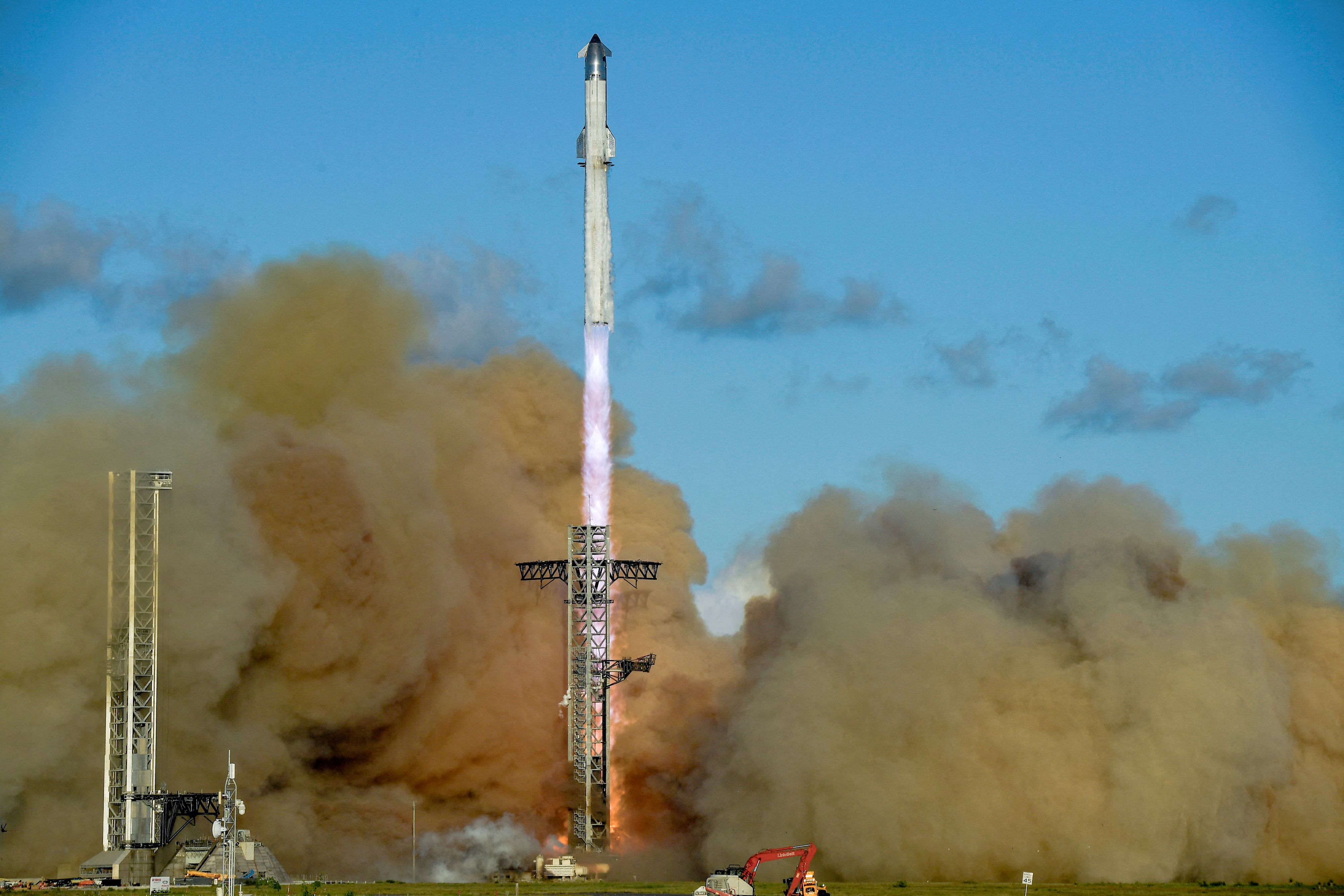 A SpaceX Super Heavy booster carrying the Starship spacecraft lifts off on its 11th test flight at the company's launch pad in Starbase, Texas, U.S., October 13, 2025. REUTERS/Steve Nesius