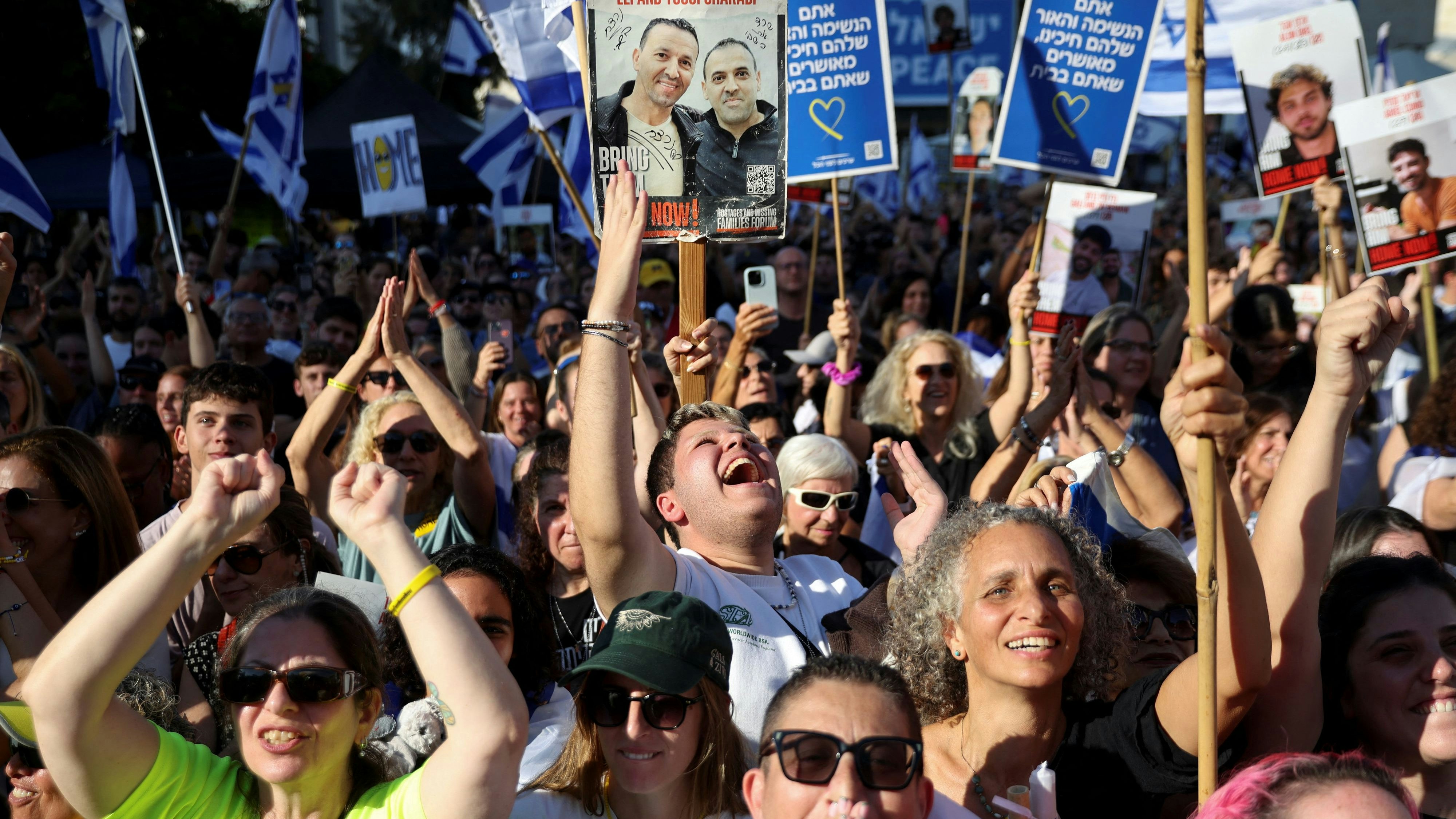 People gather at "Hostages Square" on the day Hamas releases hostages, who have been held in Gaza since the deadly October 7, 2023 attack by Hamas, as part of a prisoner-hostage swap and a ceasefire deal between Israel and Hamas, in Tel Aviv, Israel, October 13, 2025. REUTERS/Shir Torem