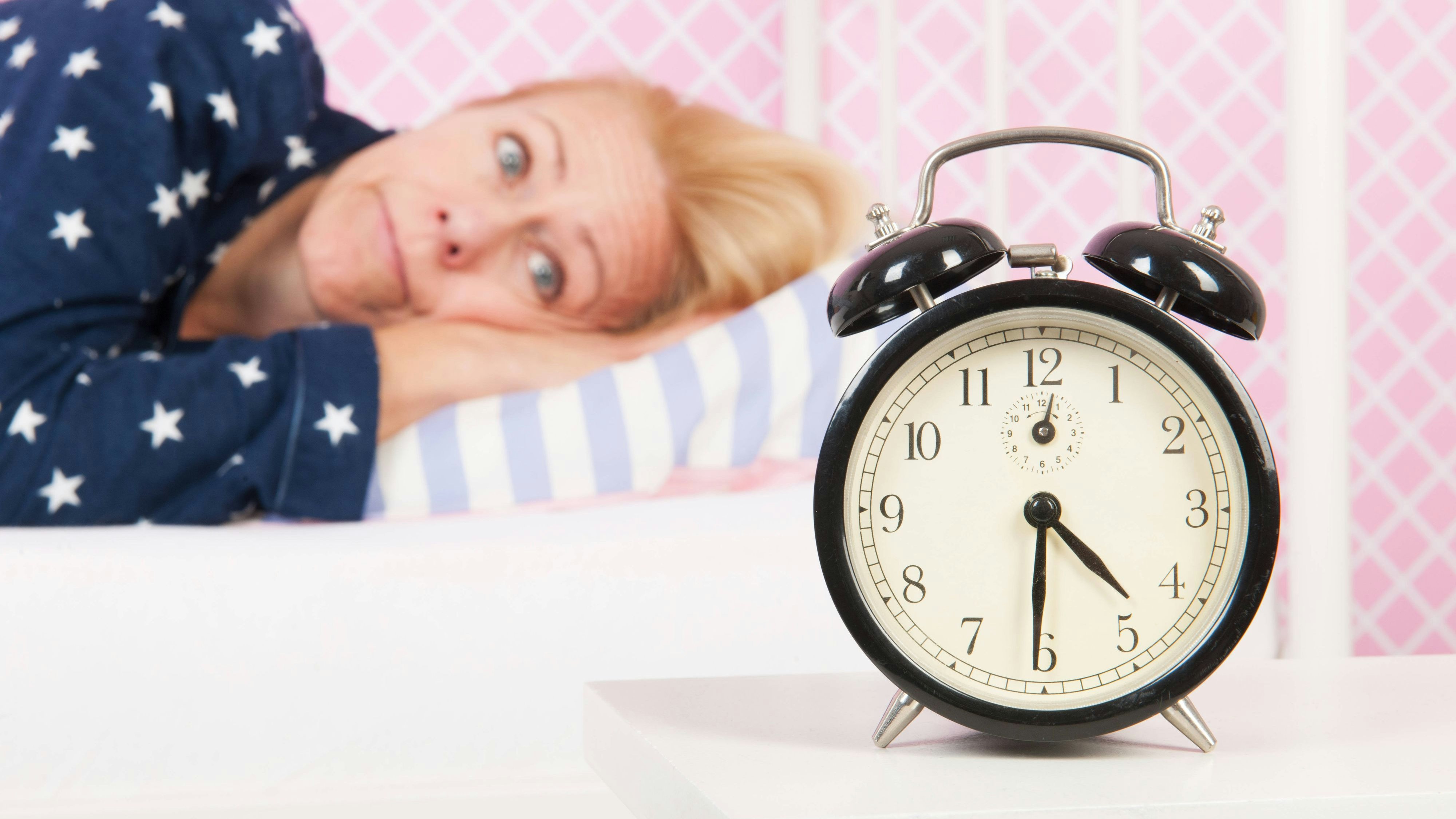 Mature woman with insomnia Blond woman of mature age with insomnia and big alarm clock - focus point on clock ,model released, Symbolfoto Copyright: xZoonar.com/IvonnexWierinkx 8069295 ,model released, Symbolfoto ,property released