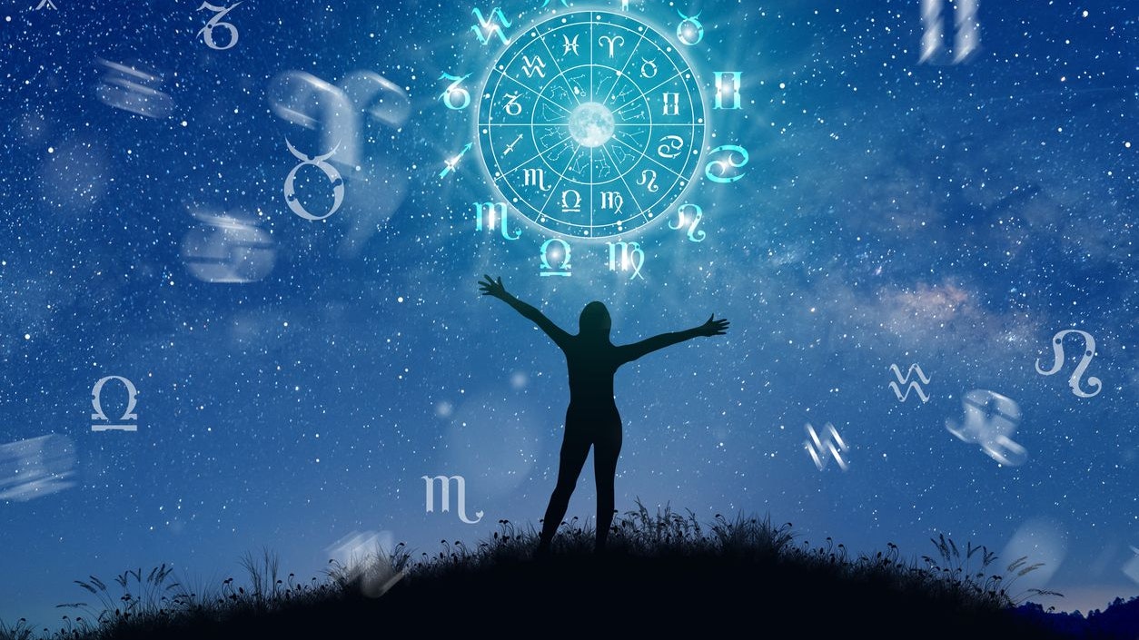 Astrological zodiac signs inside of horoscope circle. Illustration of Woman silhouette consulting the stars and moon over the zodiac wheel and milky way background. The power of the universe concept.